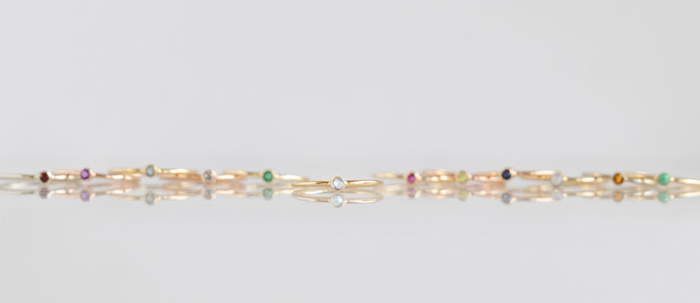 Moonstone Stacking Ring Featured with Other Birthstone Stacking Rings Behind