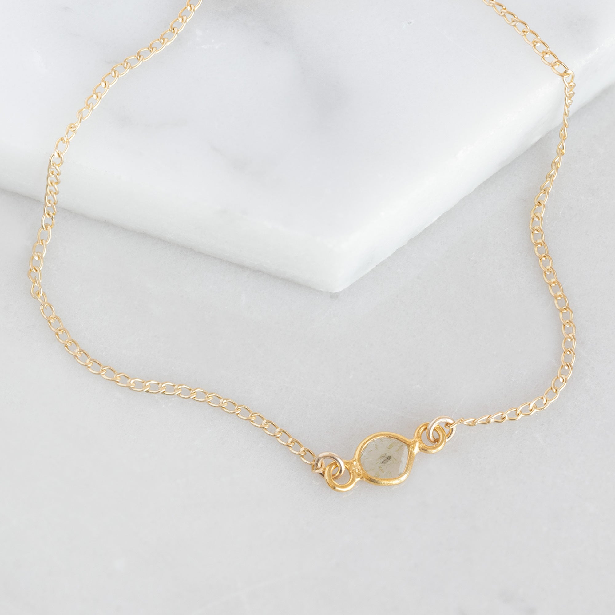 The Salt and Pepper Diamond Slice Bracelet in Yellow Gold Filled on White Marble