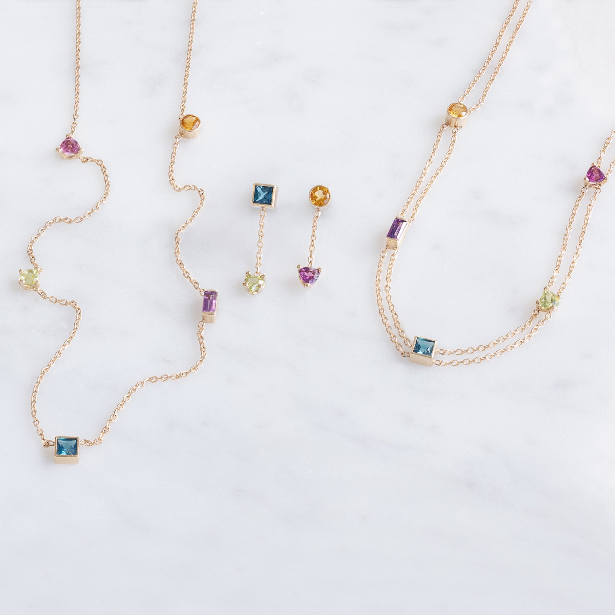 The Candy Gemstone Collection in 10K Yellow Gold on White Marble