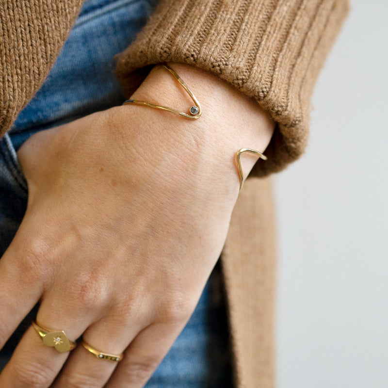 The Sapphire Arrow Cuff Bracelet in Yellow Gold Filled on Model