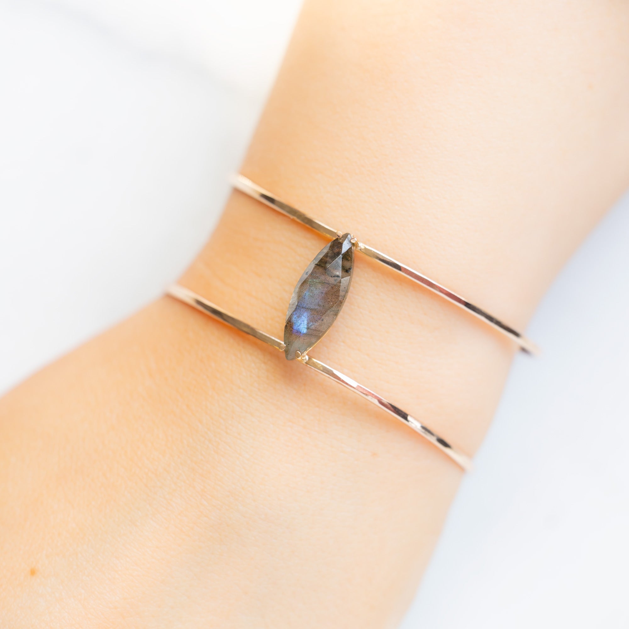 The Labradorite Cage Cuff Bracelet in Yellow Gold Filled on Model