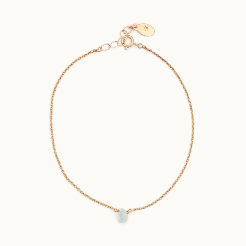 The Opal Teardrop Bracelet in Yellow Gold Filled on White Background