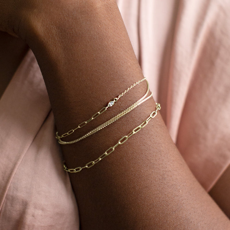 buy:the-asymmetrical-diamond-eye-bracelet-14k-yellow-gold,the-4-in-1-cable-chain-bracelet-gold-filled