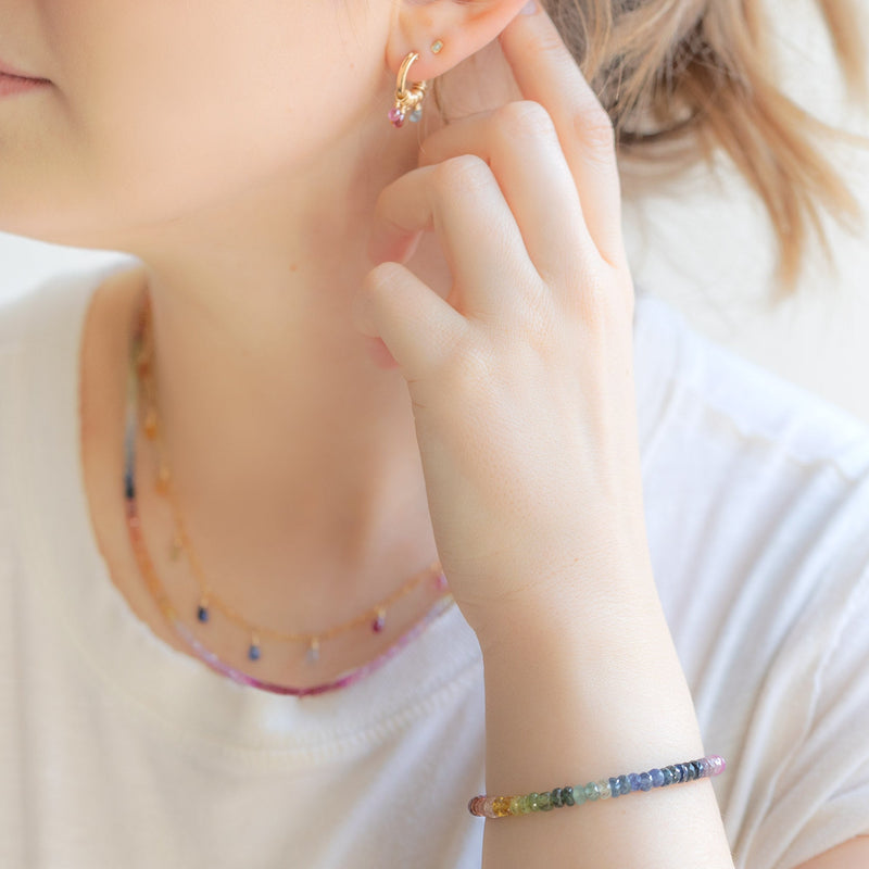 buy:the-rainbow-sapphire-beaded-bracelet-gold-filled,the-rainbow-sapphire-beaded-necklace-gold-filled,the-rainbow-sapphire-briolette-necklace-gold-filled,the-rainbow-sapphire-hoop-earrings-gold-filled,the-white-diamond-baguette-stud-earrings-14k-yellow-gold