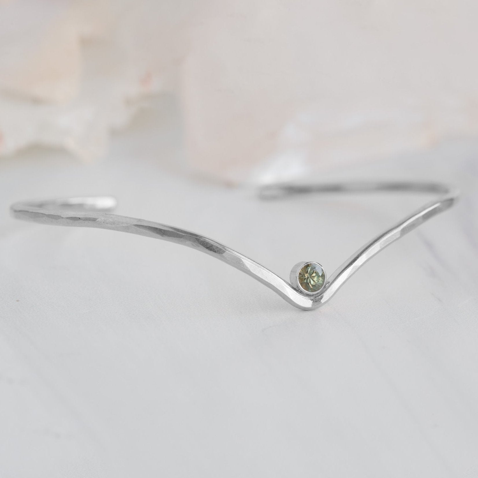 The Montana Sapphire Peak Cuff Bracelet in Sterling Silver on White Marble