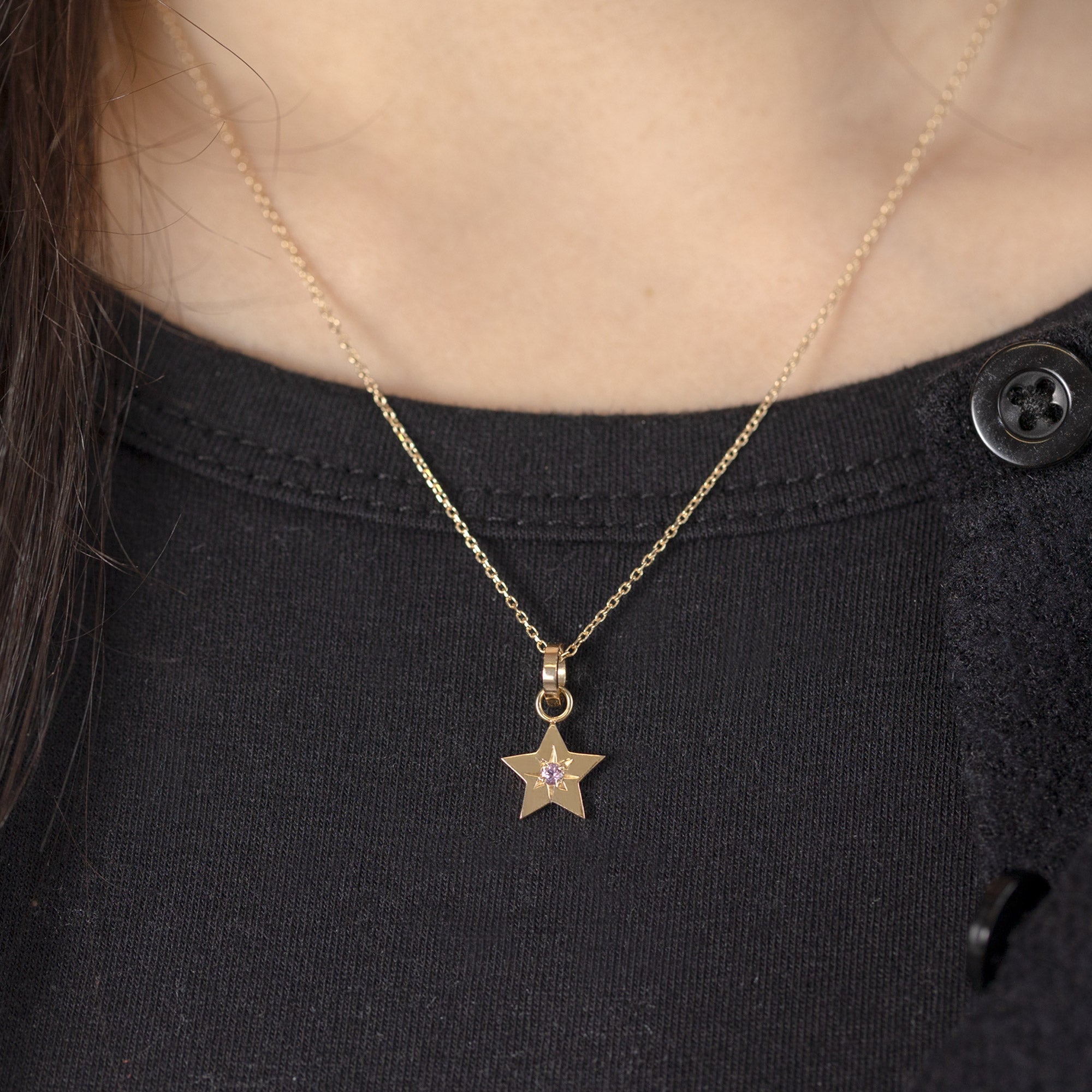 The Star Charm in 10K Yellow Gold on Diamond Cut Cable Chain Necklace on Model