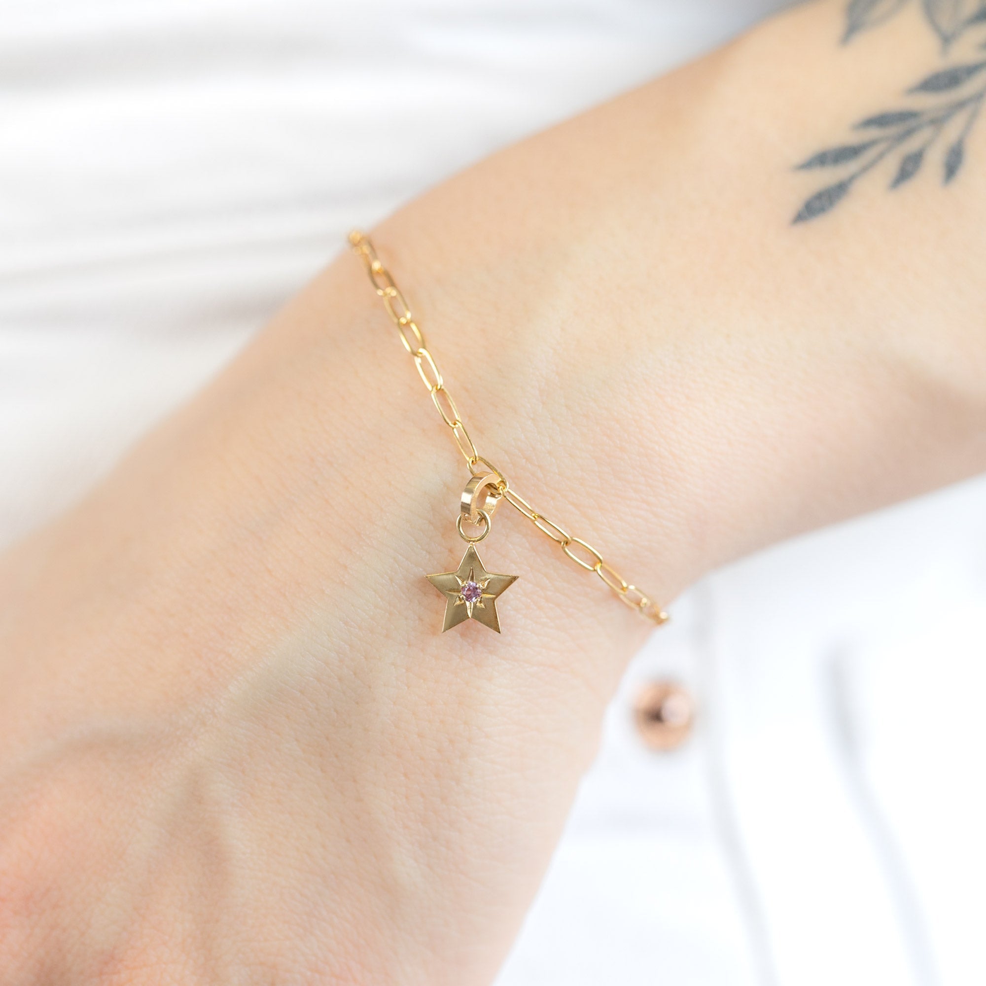 The Star Charm in 10K Yellow Gold on Drawn Cable Chain Bracelet on Model