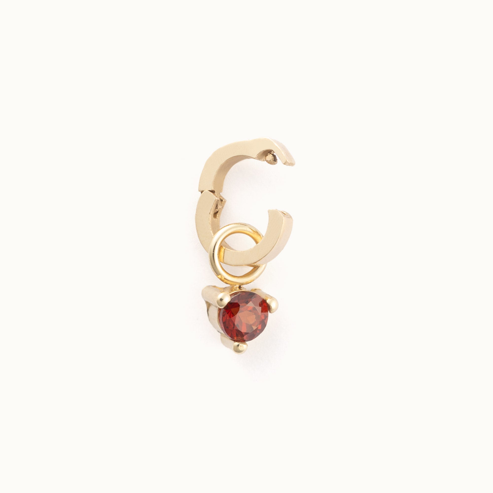 The Garnet Birthstone Charm in 10K Yellow Gold on White Background