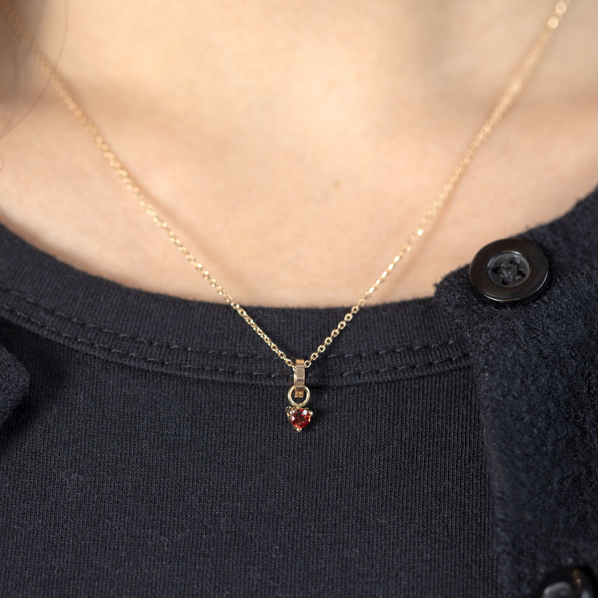 The Garnet Birthstone Charm in 10K Yellow Gold on Diamond Cut Cable Chain Necklace on Model