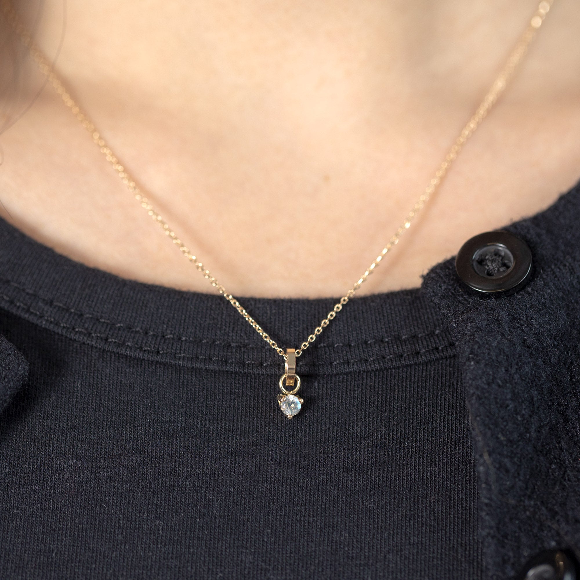 The Moonstone Birthstone Charm in 10K Yellow Gold on Diamond Cut Cable Chain Necklace on Model