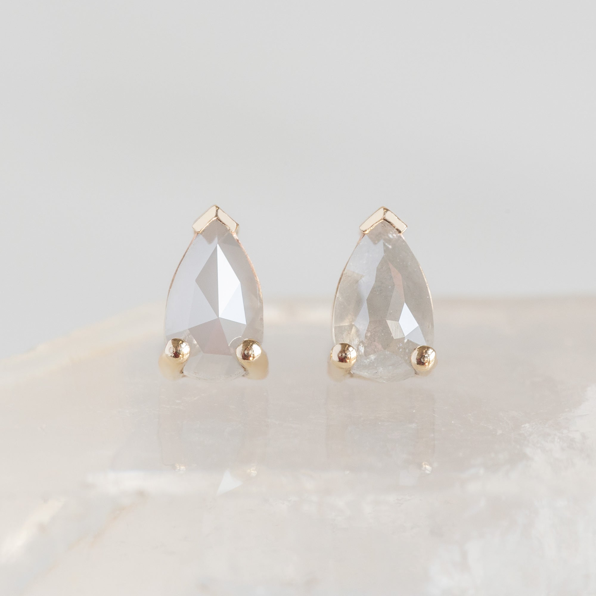 The Opalescent Icy White Diamond Stud Earrings in 10K Yellow Gold on White Crystal