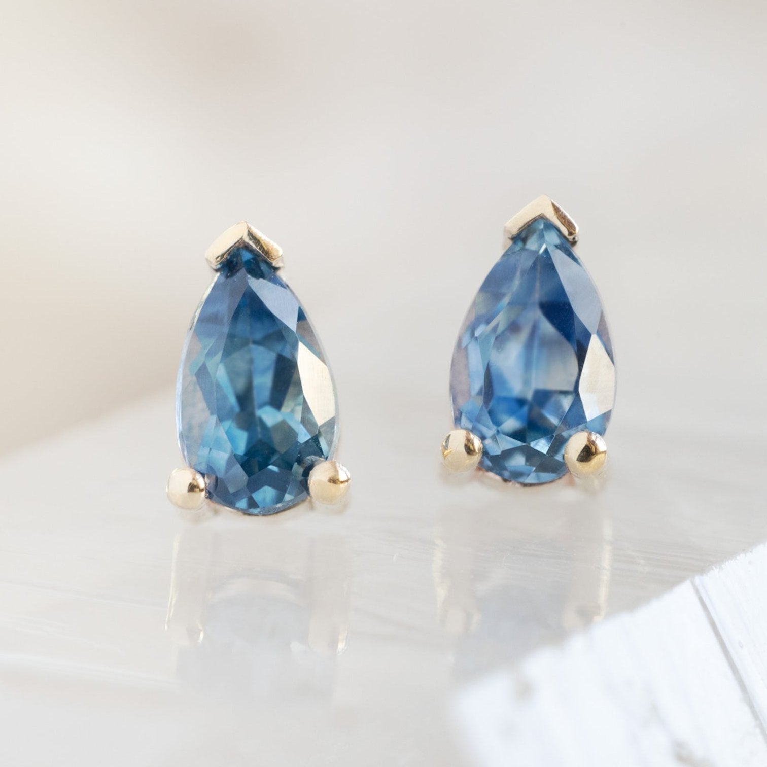 The Montana Sapphire Stud Earrings in 10K Yellow Gold on White Crystal