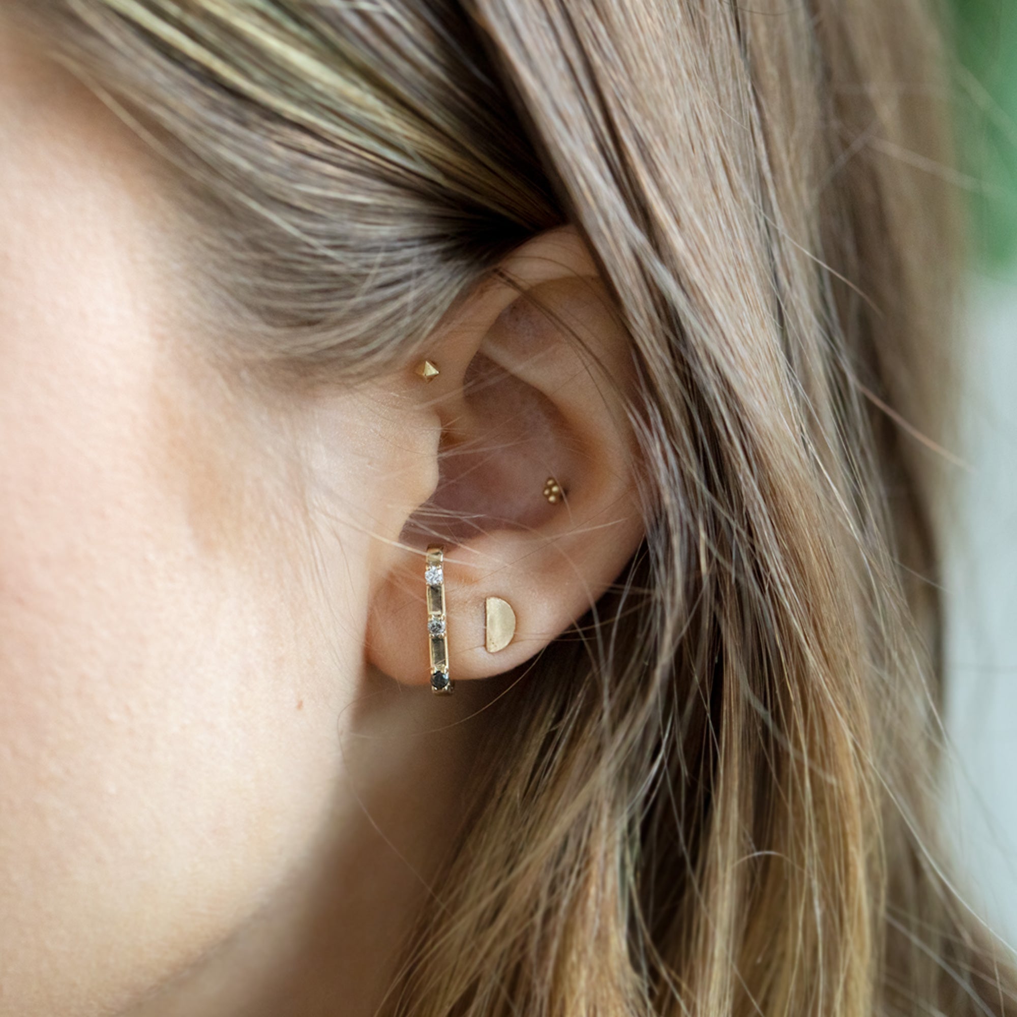 buy:the-gold-half-moon-stud-earrings-14k-yellow-gold,the-ombre-diamond-ear-huggie-14k-yellow-gold