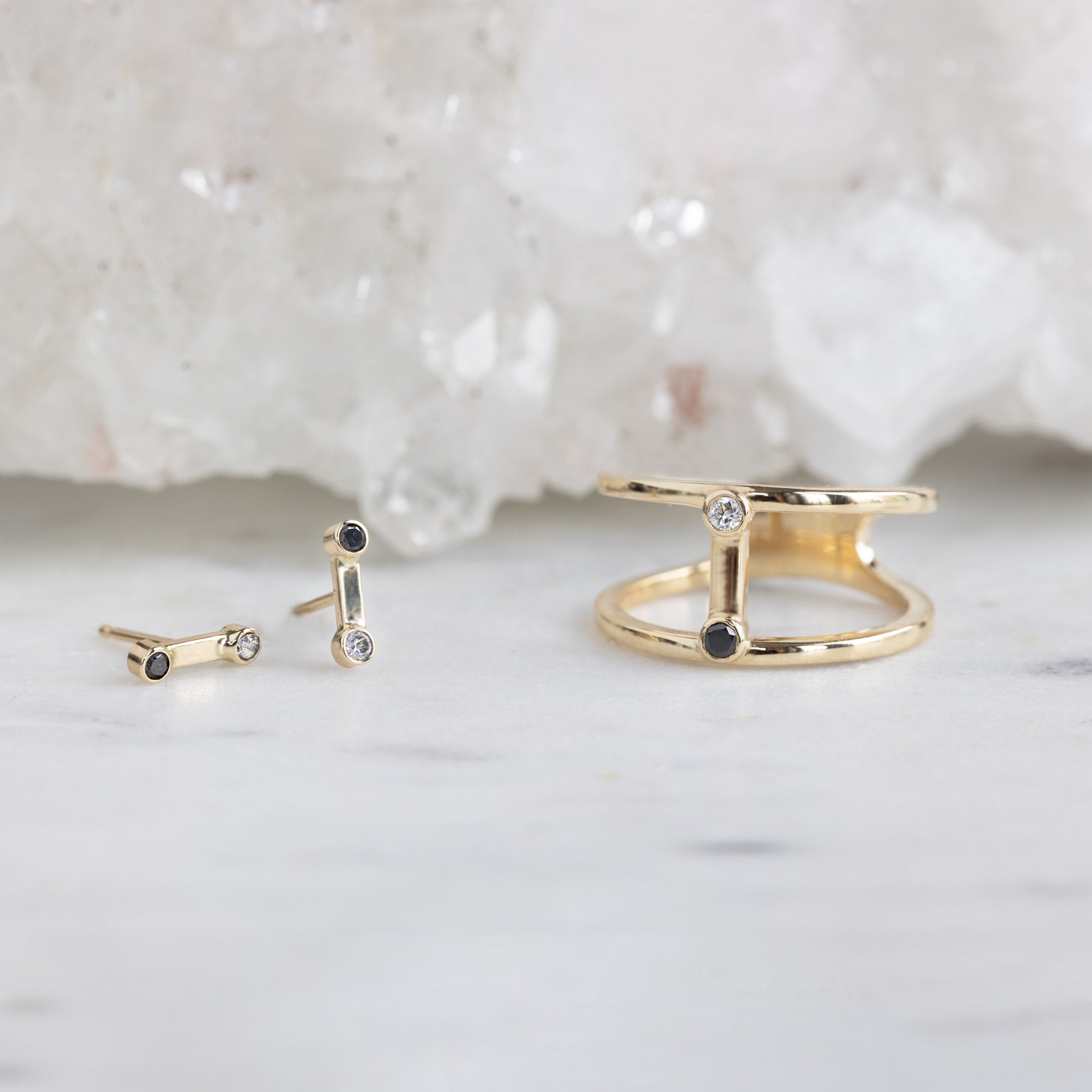 The Duality Diamond Collection in 14K Yellow Gold on White Marble