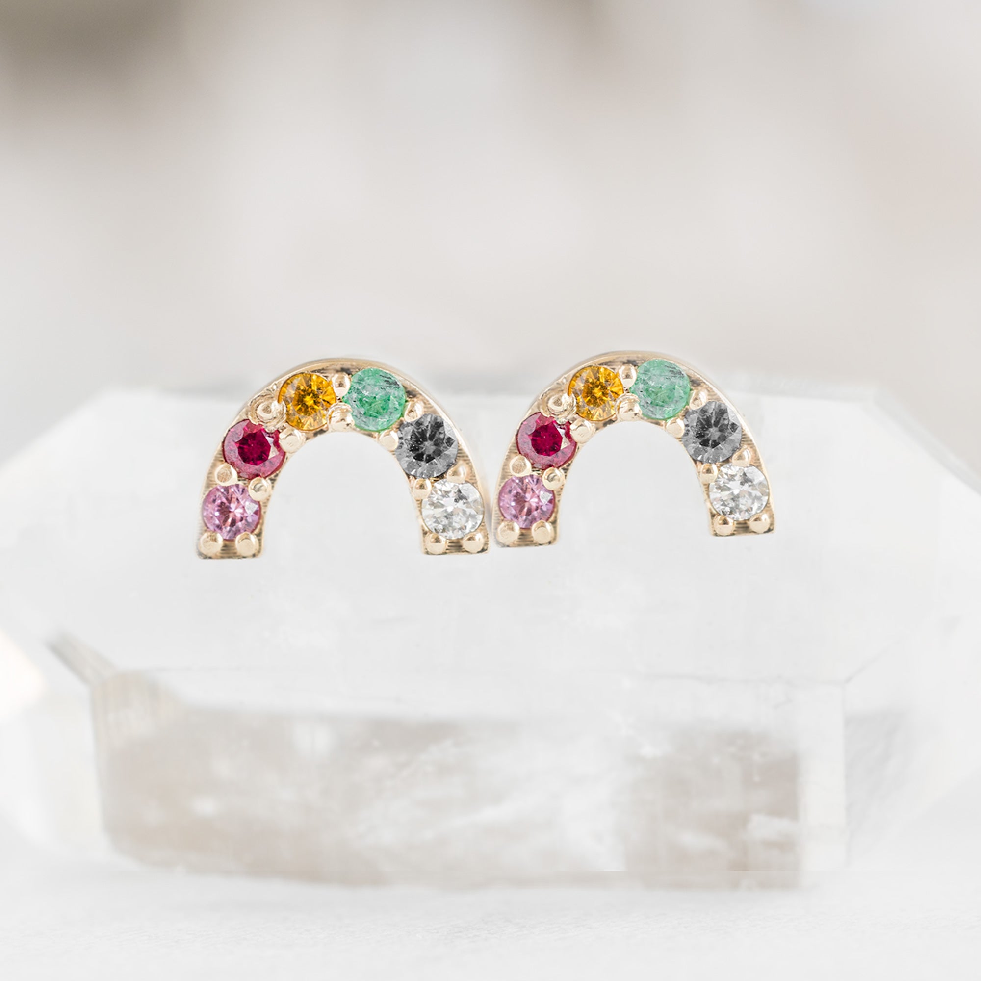 The Rainbow Sapphire Stud Earrings in 14K Yellow Gold on White Crystal