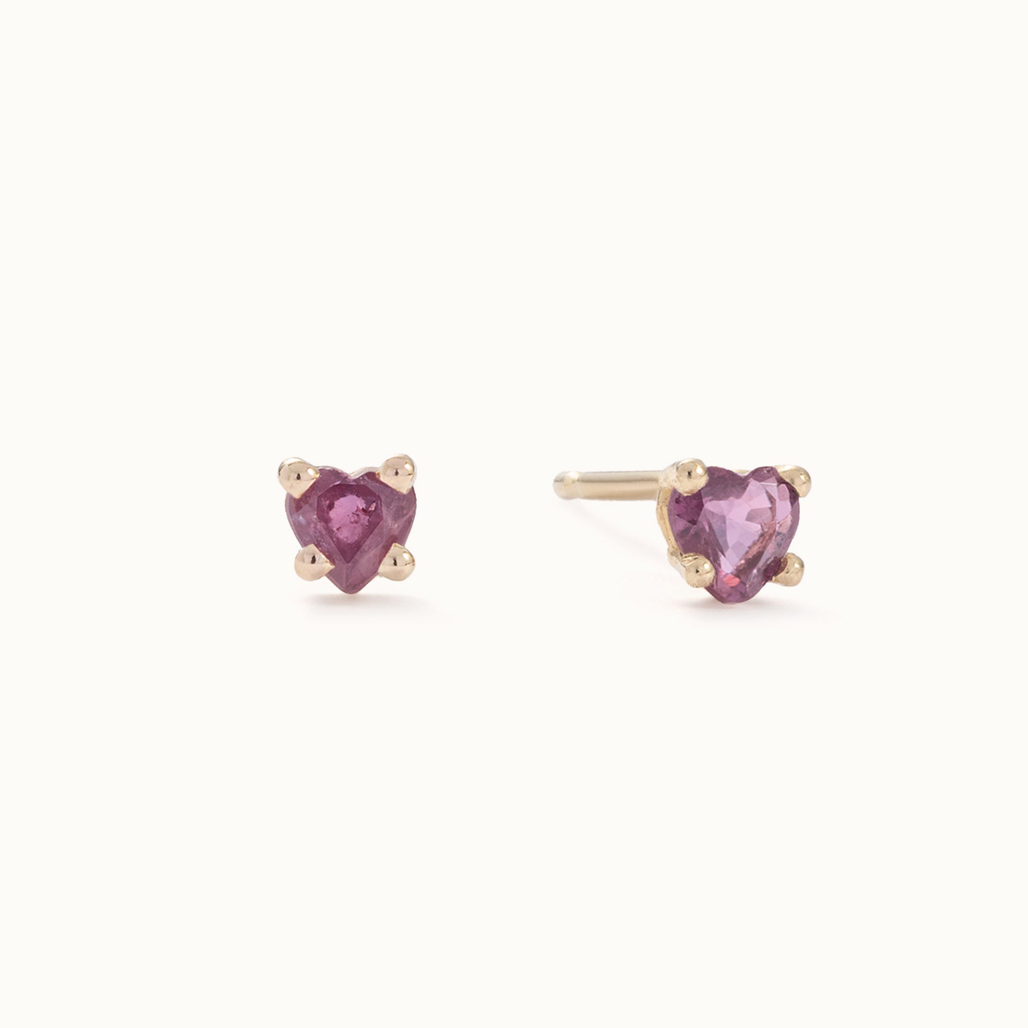 The Teensy Ruby Heart Studs in 14K Yellow Gold on White Background