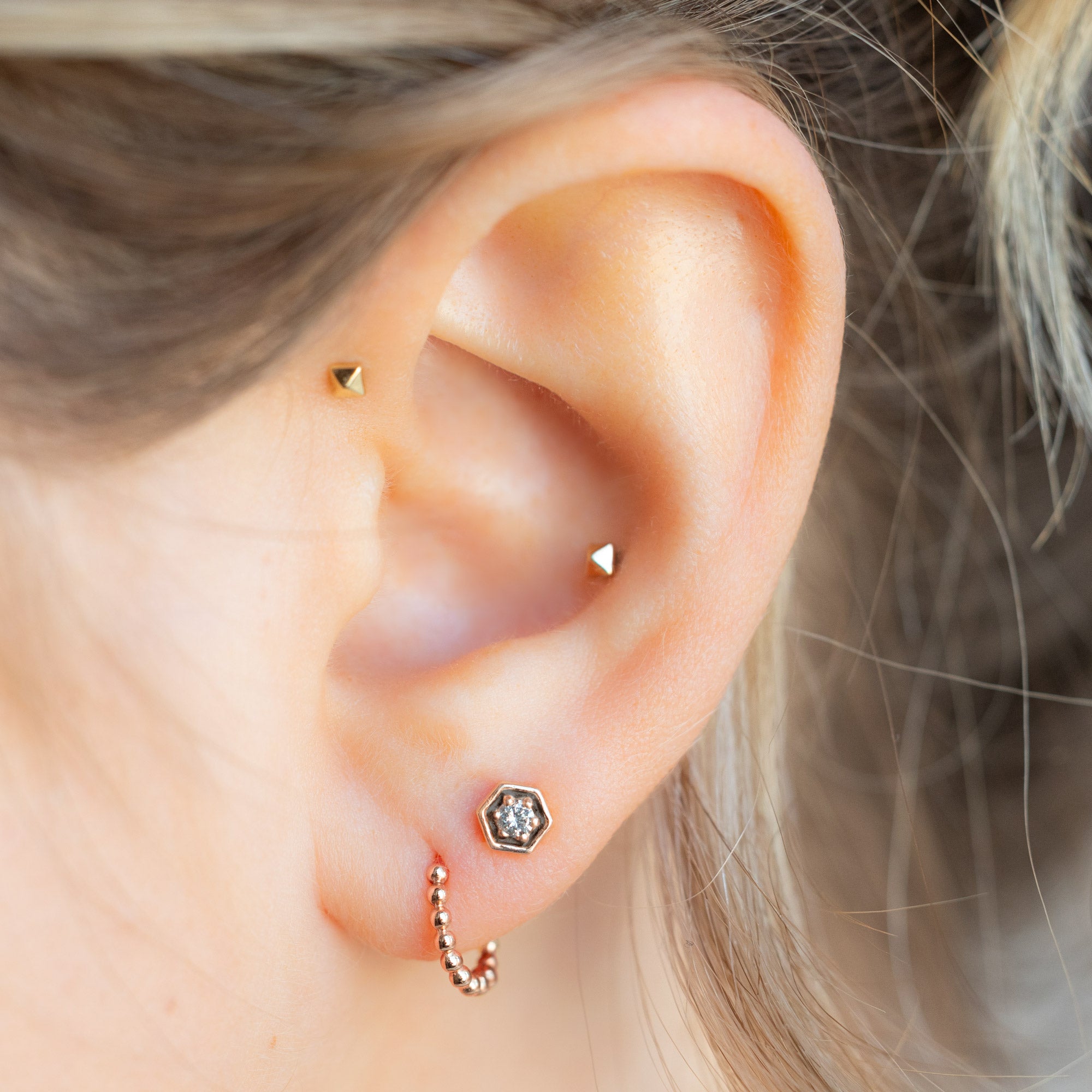 buy:the-galaxy-salt-and-pepper-diamond-hexagon-stud-earrings-14k-rose-gold,the-beaded-huggie-hoops-14k-rose-gold