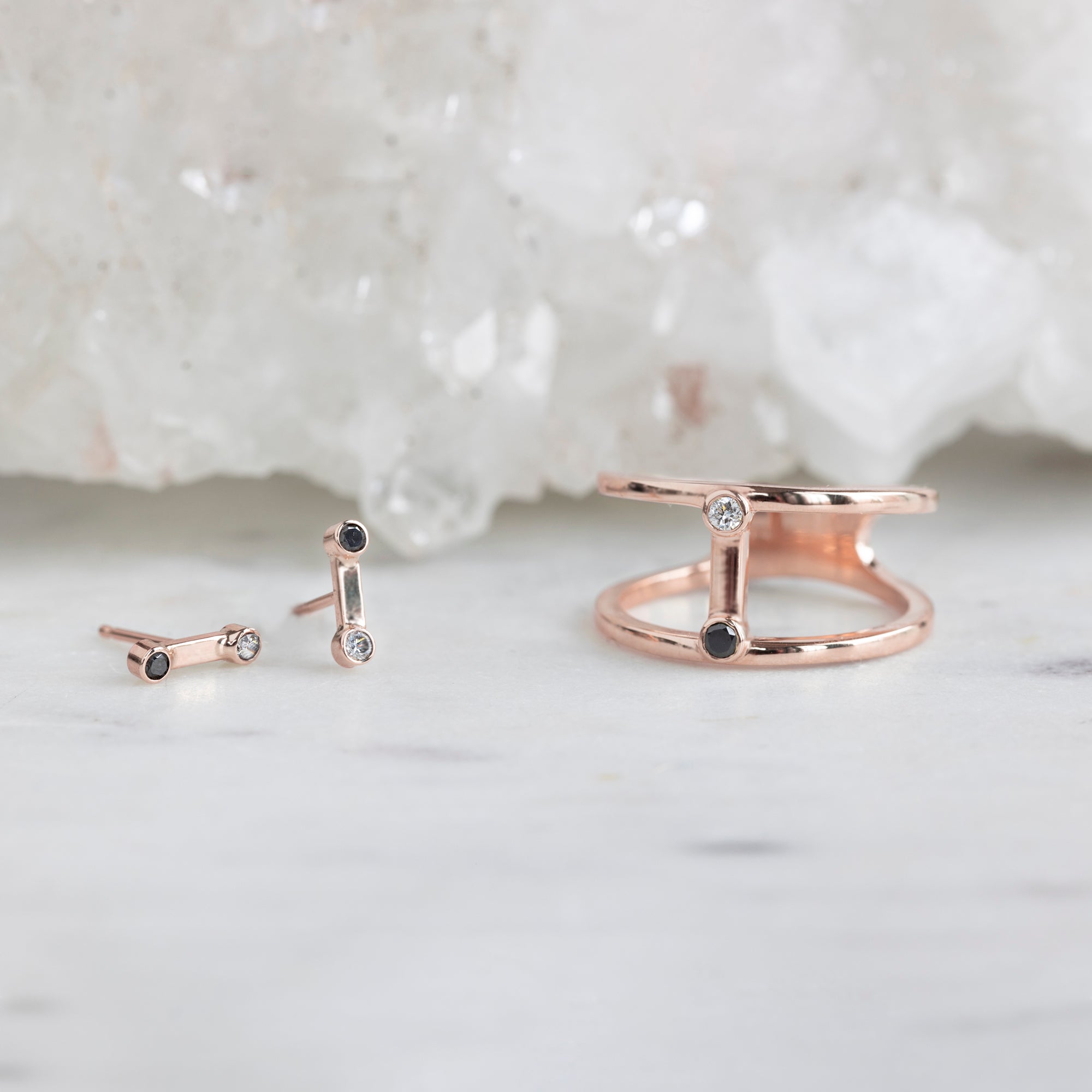 The Duality Diamond Stud Earrings and Cage Ring in 14K Rose Gold on White Marble