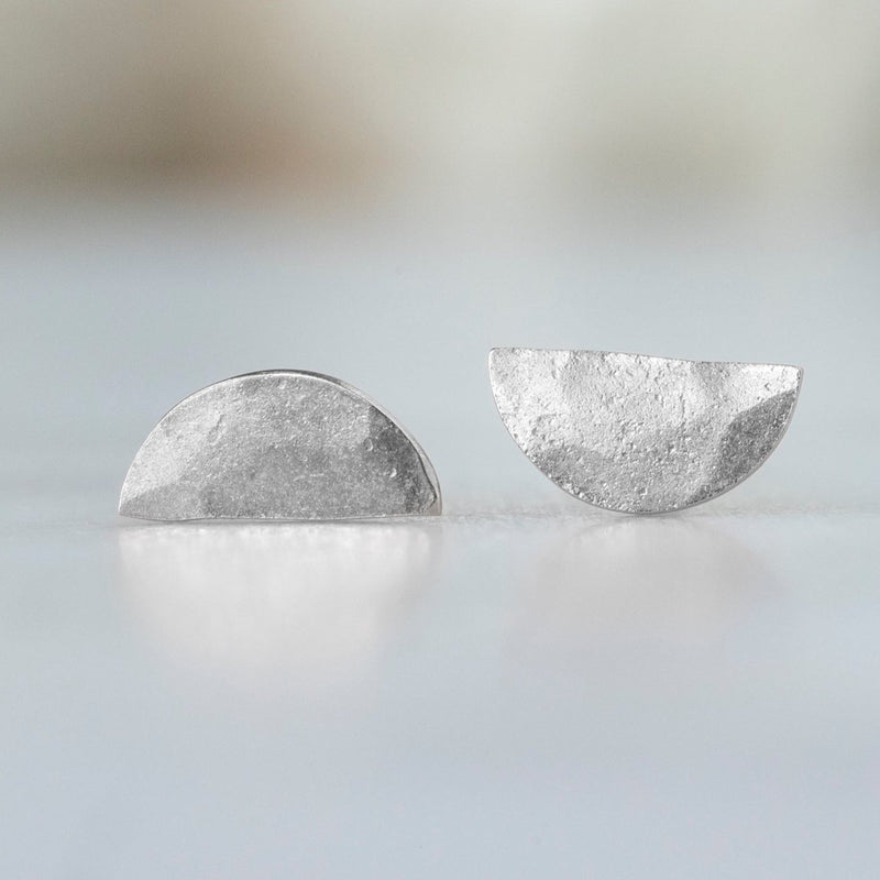 The Gold Half Moon Stud Earrings in 14K White Gold on White Marble