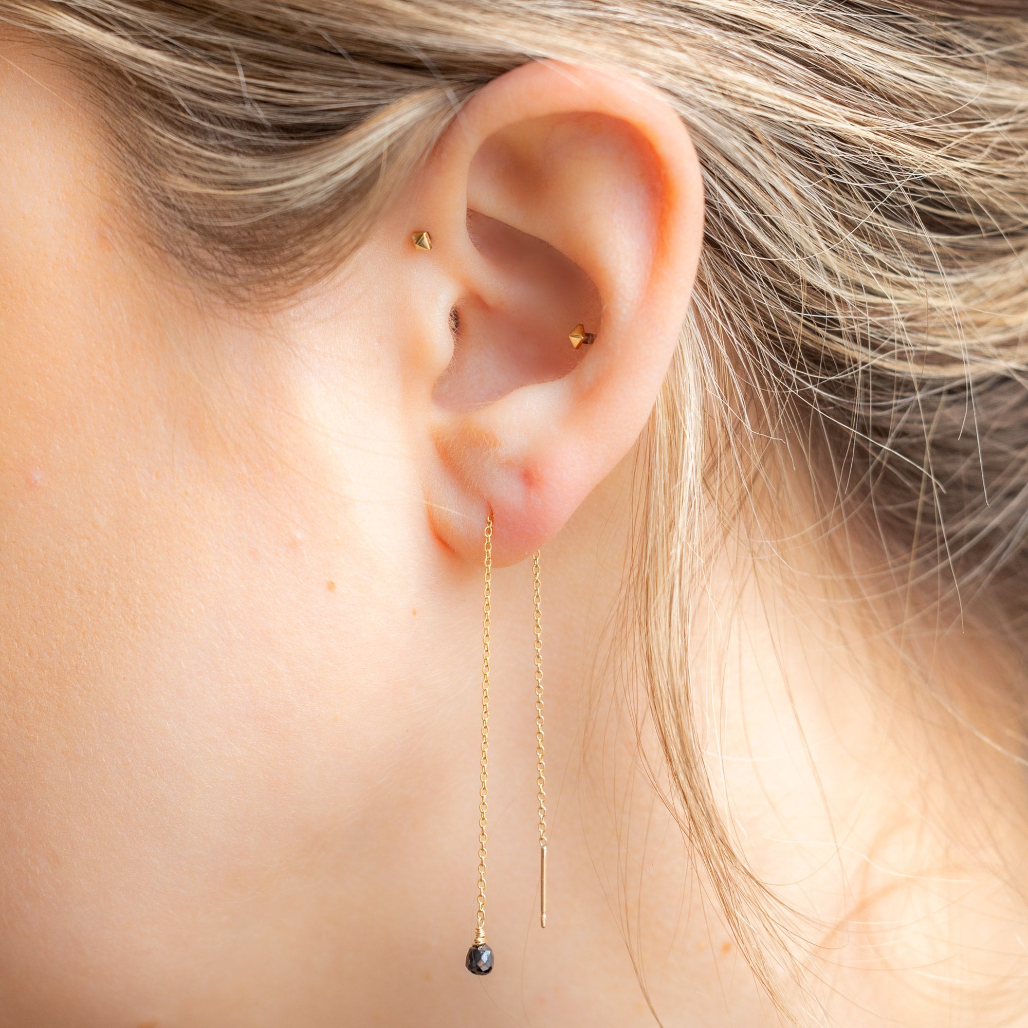 The Simple Black Diamond Drop Thread Earrings in Yellow Gold Filled Stacked on Model