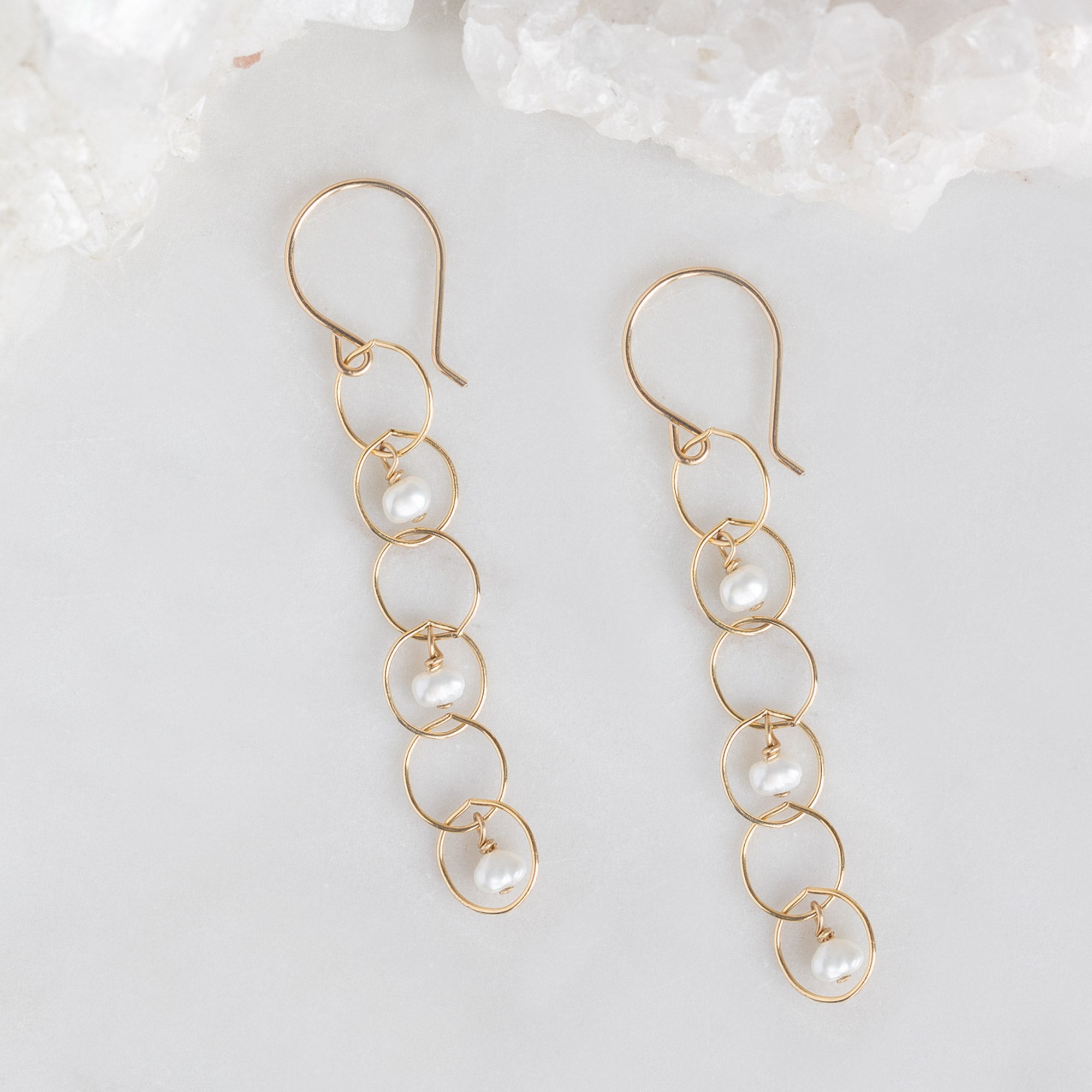 The Pearl Party Drop Earrings in Yellow Gold Filled on White Marble