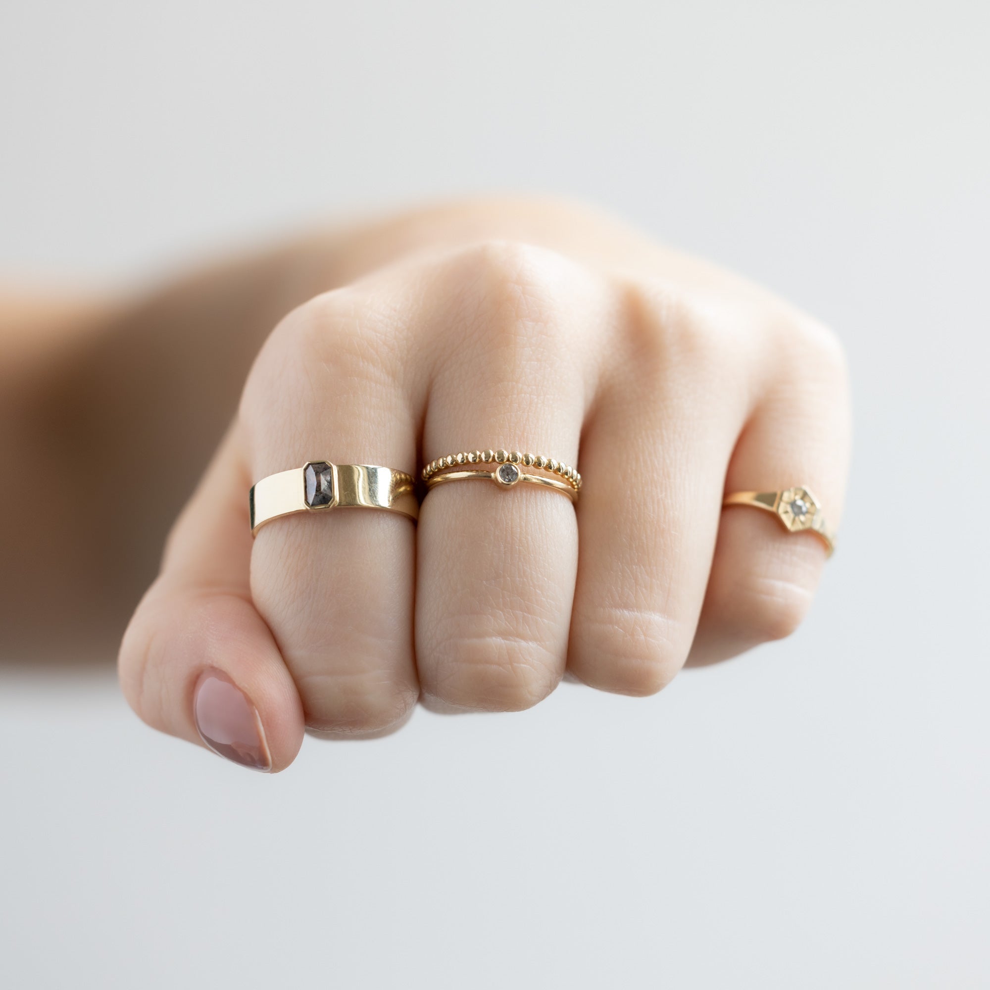 buy:the-cigar-band-0-38ct-emerald-salt-and-pepper-diamond-in-14k-yellow-gold,the-gold-beaded-stacking-ring-14k-yellow-gold,the-teensy-custom-salt-and-pepper-diamond-stacking-ring-14k-yellow-gold,custom-white-diamond-birthstone-signet-ring-10k-yellow-gold