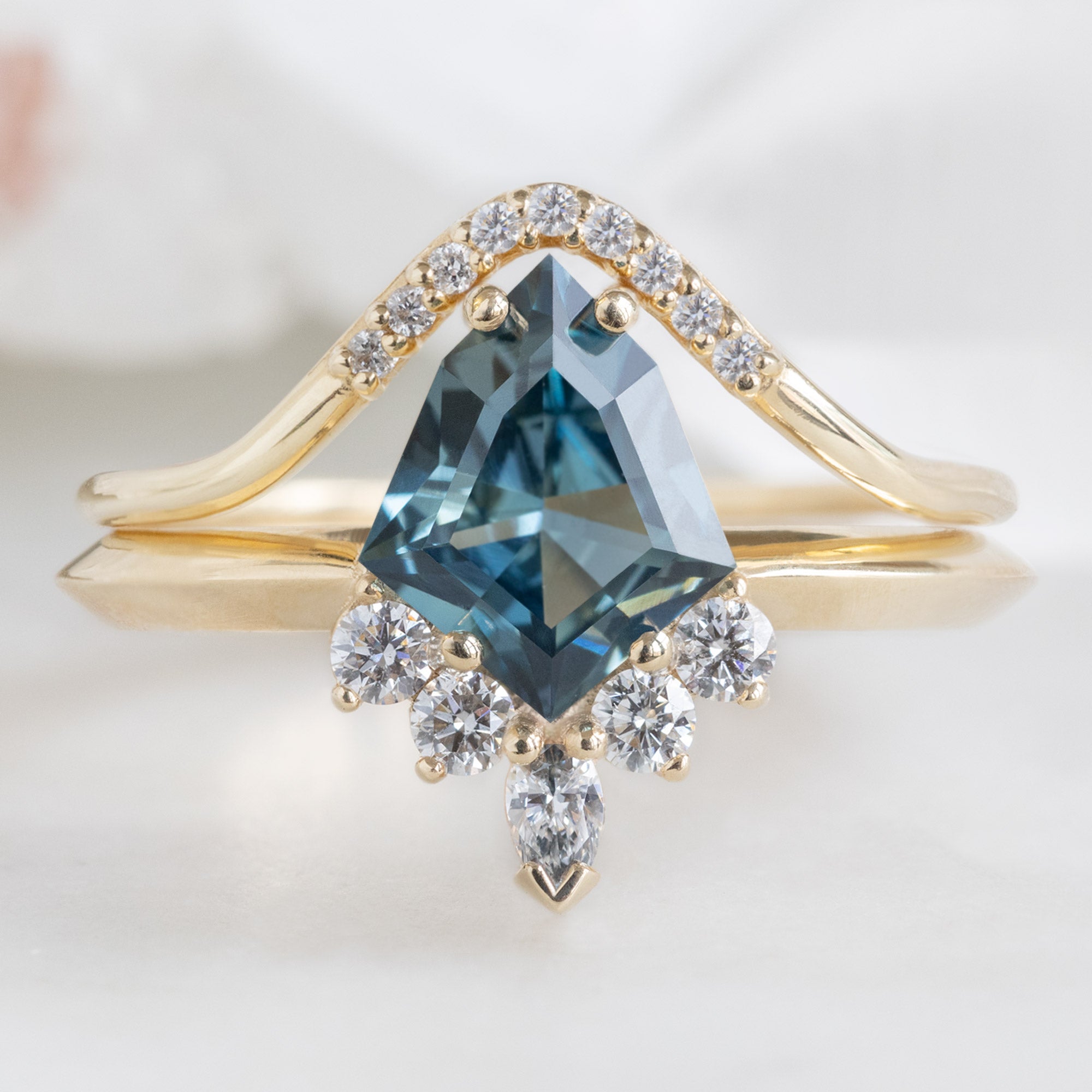 The Aster Ring with a 1.28ct Kite Blue Sapphire in 14K Yellow Gold Stacked with Pavé Peak Stacking Band