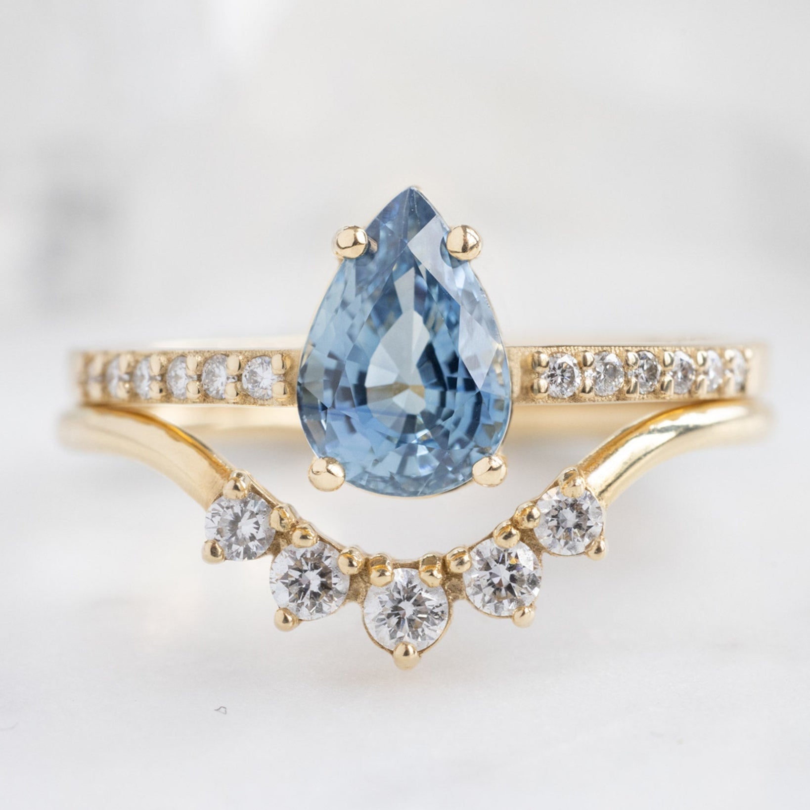 buy:the-willow-ring-1-18ct-pear-blue-sapphire-in-14k-yellow-gold,round-white-diamond-sunburst-stacking-band-14k-or-18k-yellow-gold