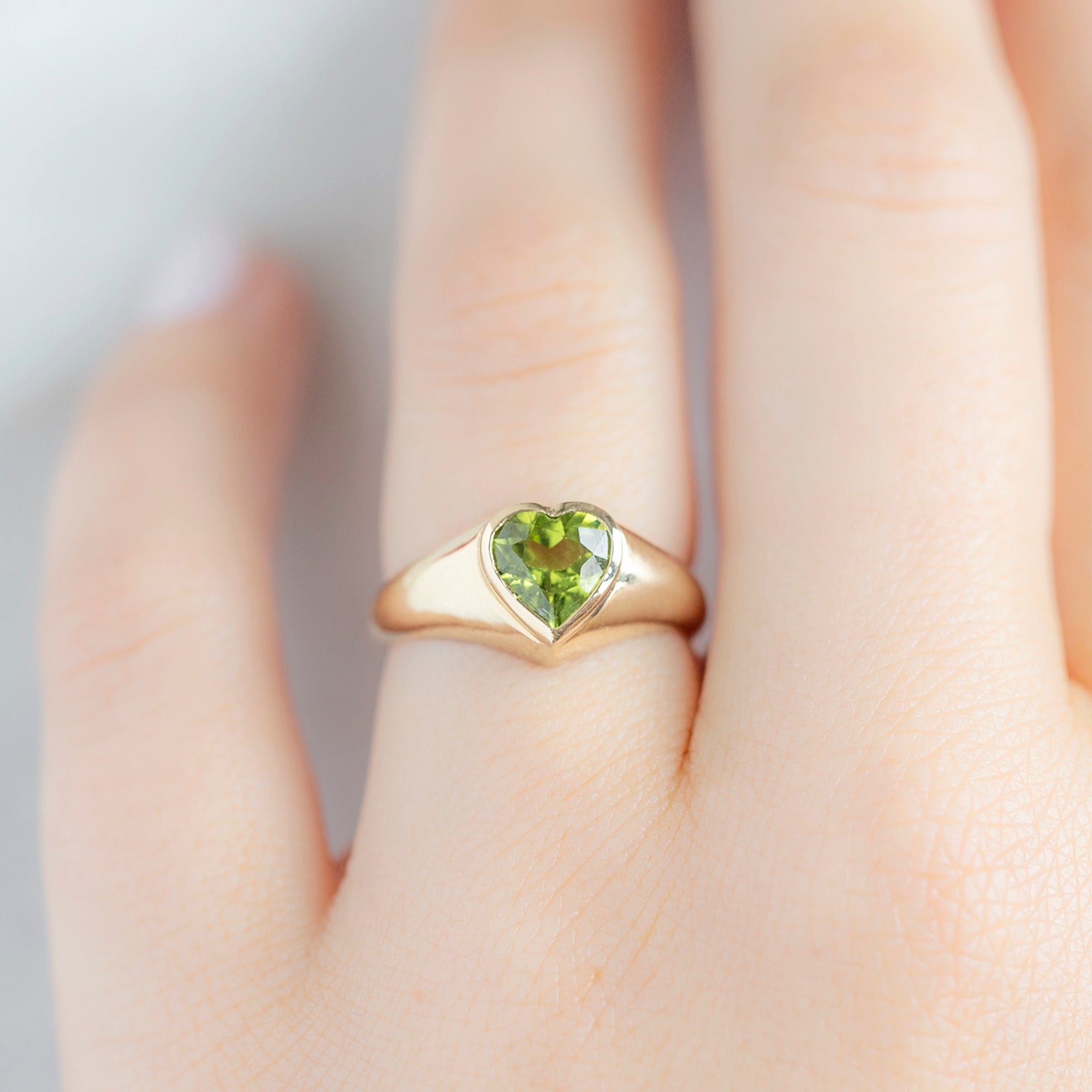 The Signet Ring with a 1.39ct Heart Peridot in 14K Yellow Gold on Model