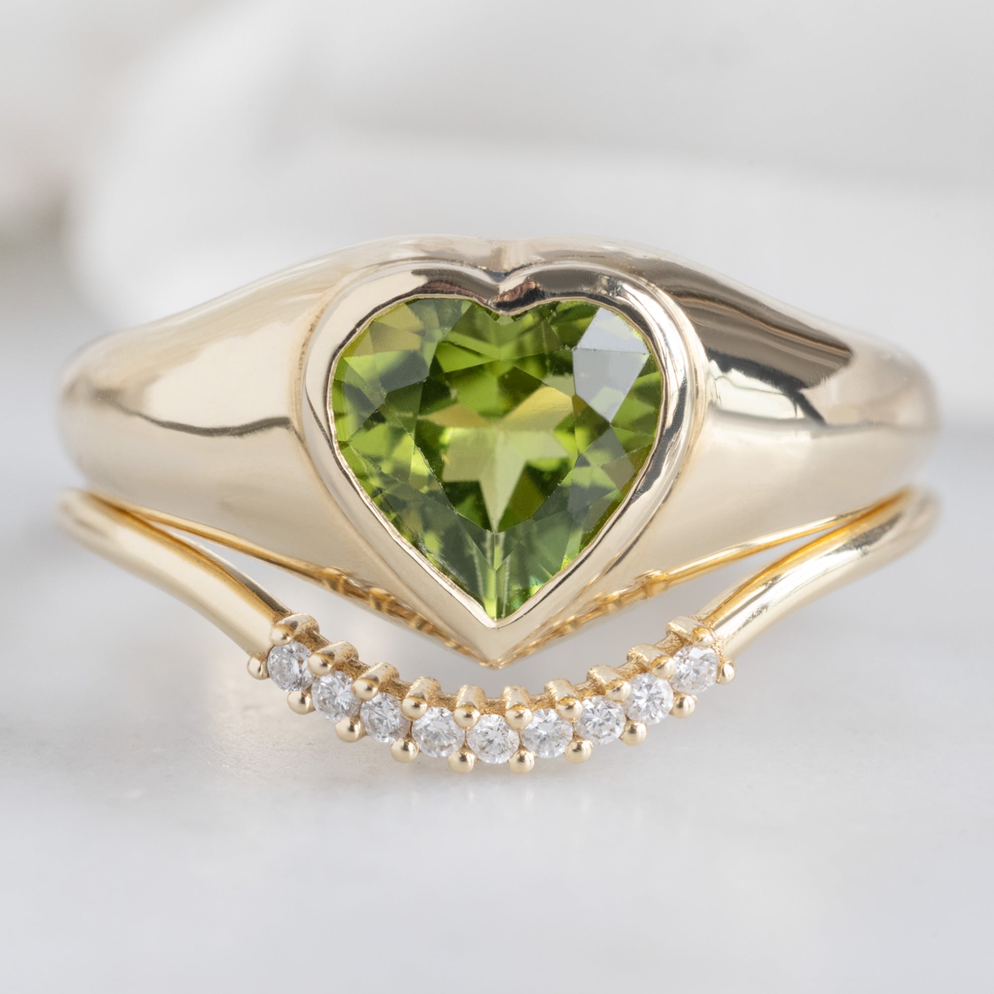 buy:the-signet-ring-1-39ct-heart-peridot-in-14k-yellow-gold,white-diamond-pave-arc-stacking-band-14k-or-18k-yellow-gold