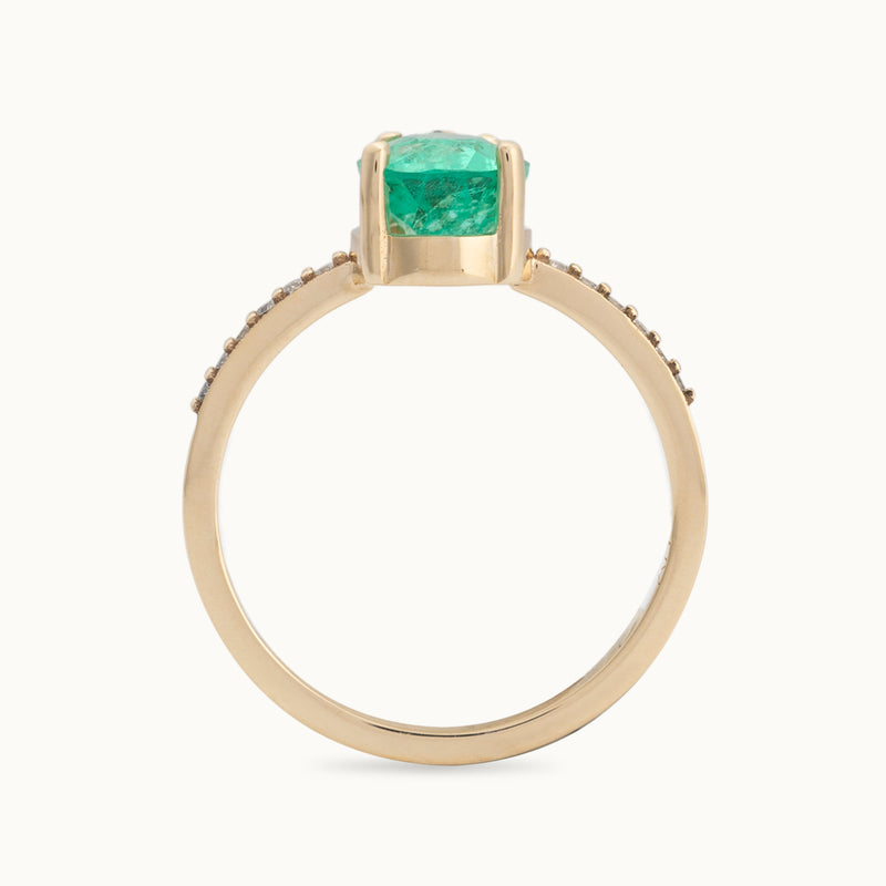 Profile View of The Willow Ring with a 1.47ct Pear Emerald in 14K Yellow Gold on White Background