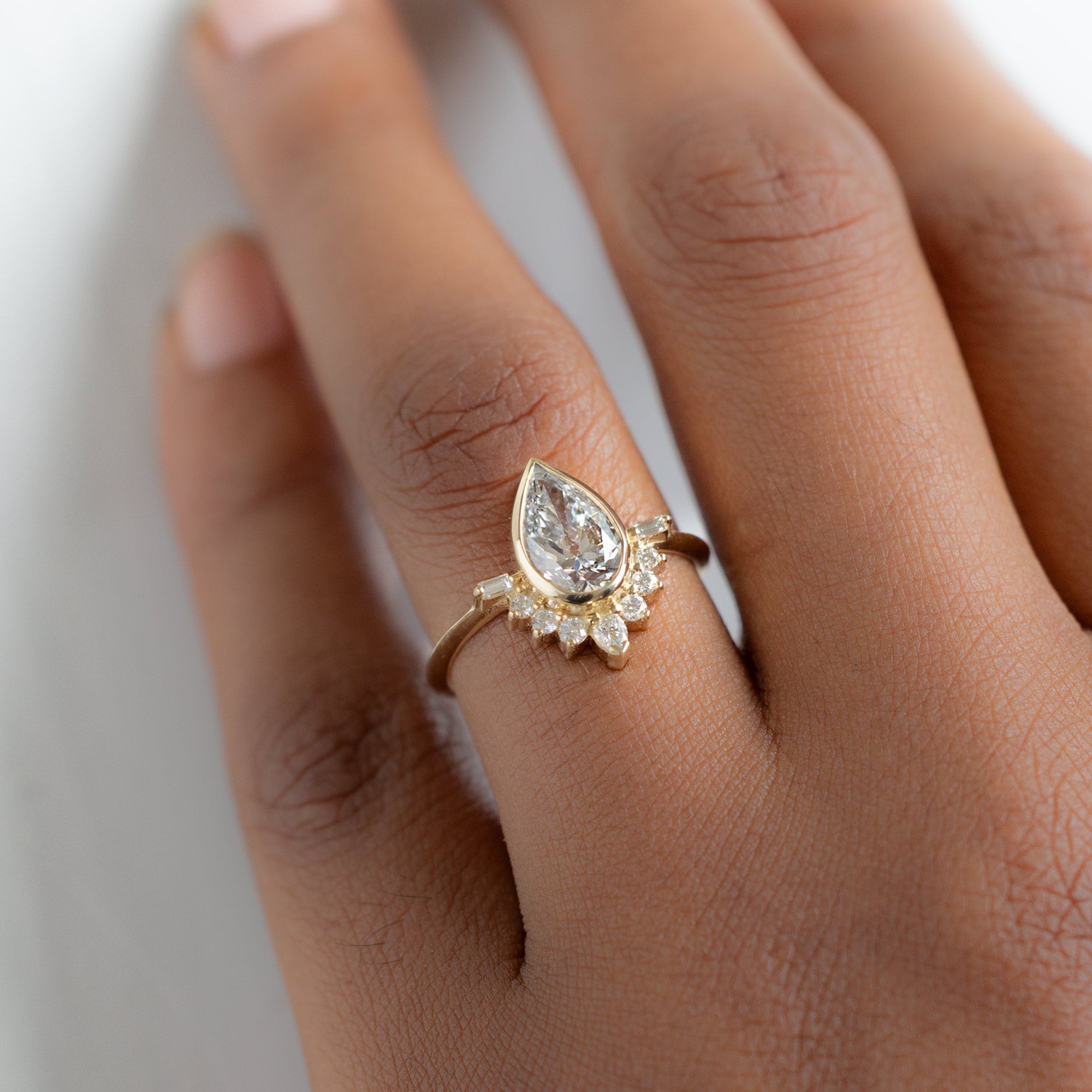 The Posy Ring with a 2.20ct Pear Lab Grown White Diamond in 14K Yellow Gold on Model