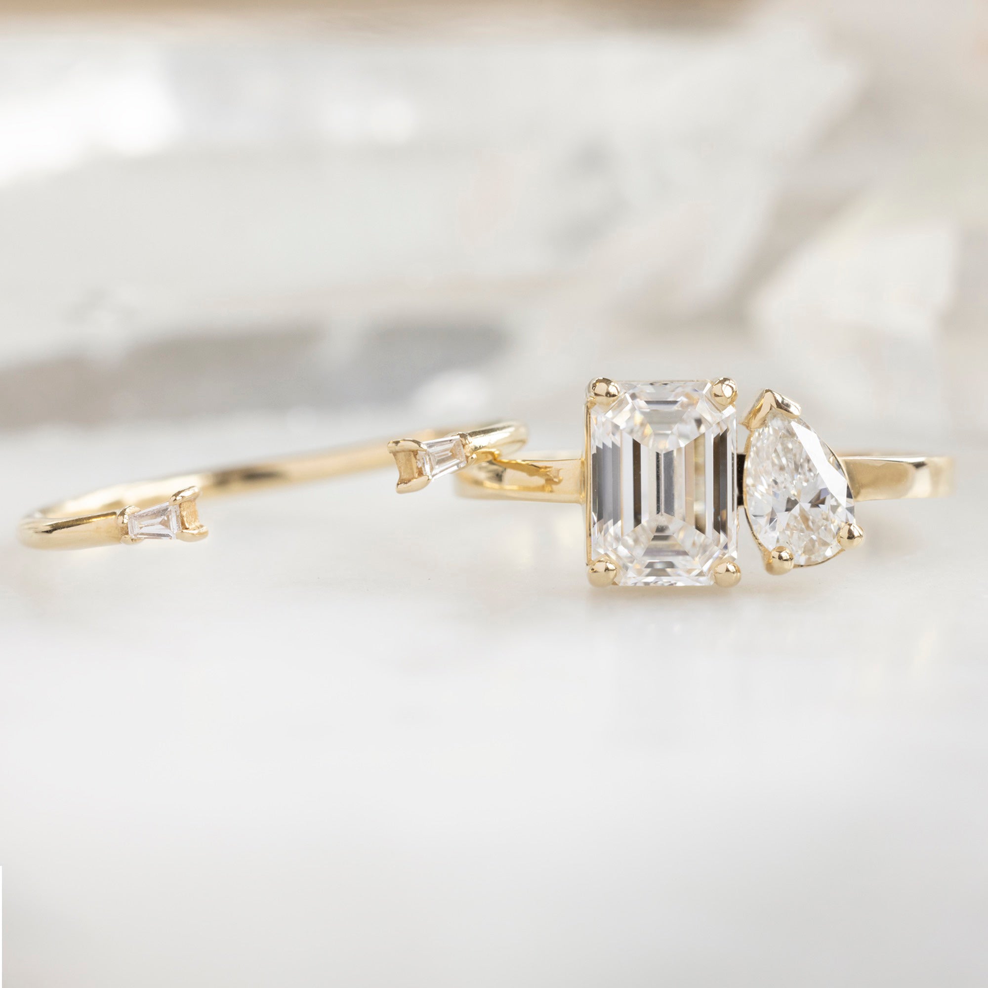 The You & Me Ring with a 1.50ct Emerald Cut Lab Grown White Diamond in 14K Yellow Gold with Open Cuff Baguette Diamond Stacking Band