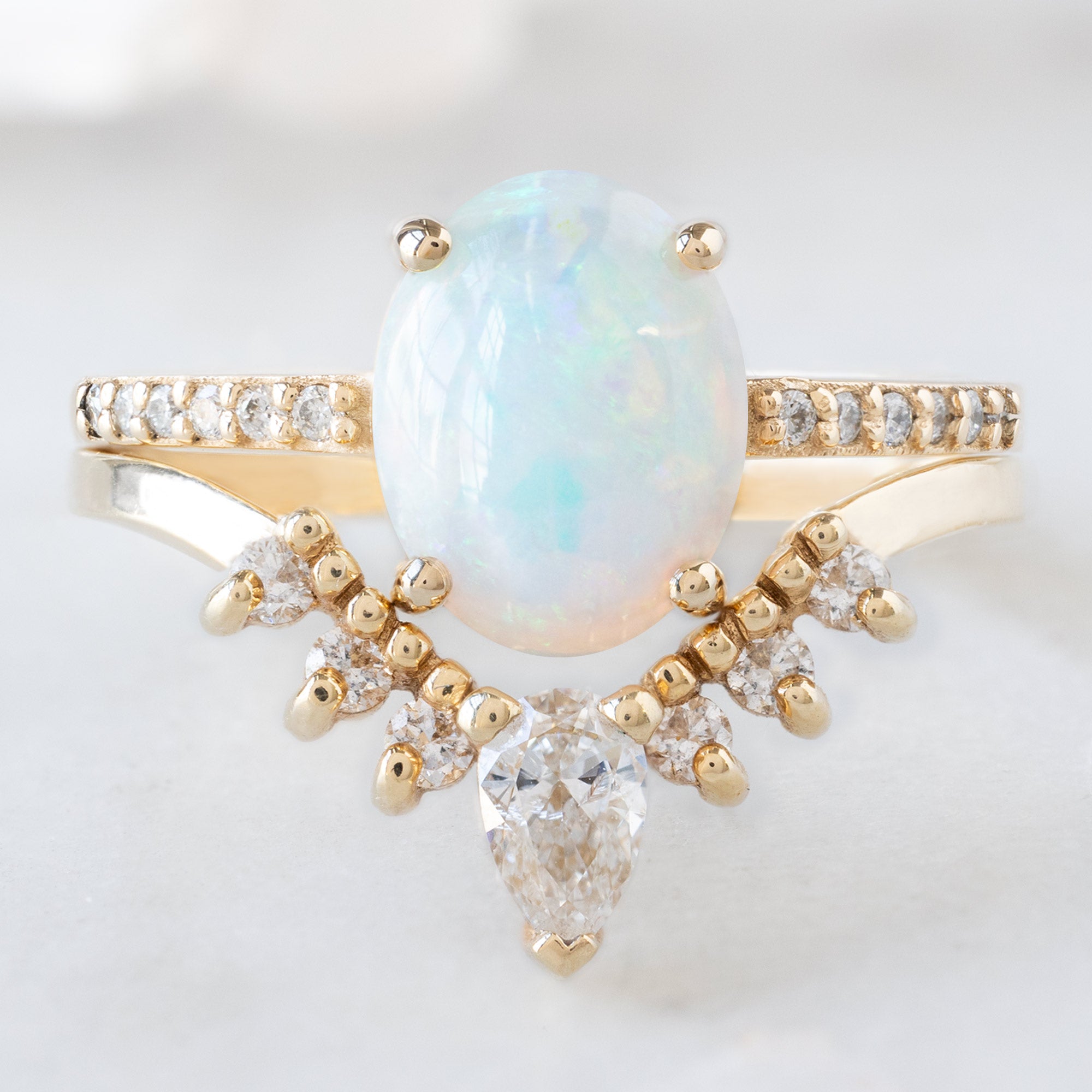 buy:the-willow-ring-1-11ct-oval-opal-in-14k-yellow-gold,white-pear-diamond-sunburst-stacking-band-14k-gold