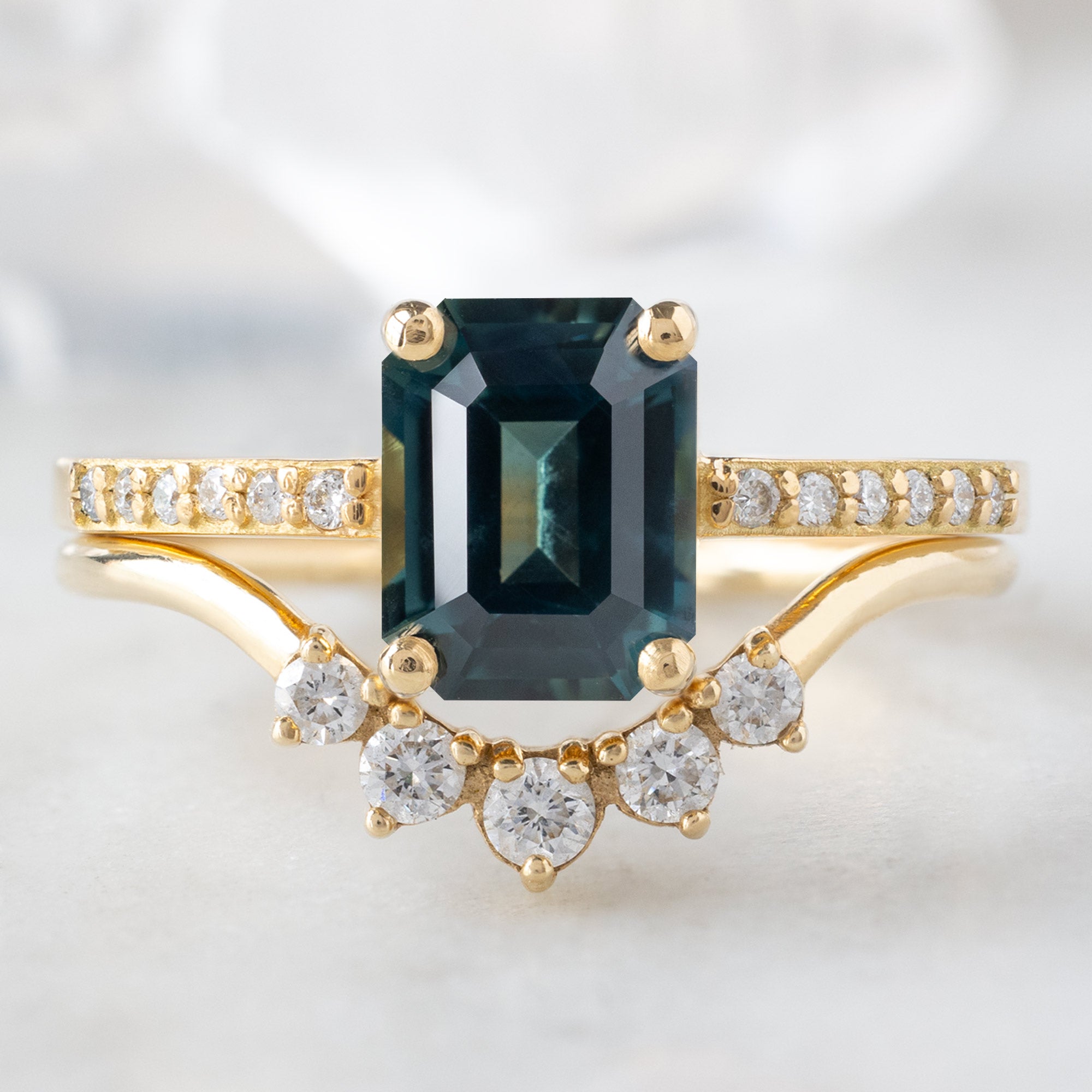 buy:the-willow-ring-1-60ct-emerald-cut-teal-sapphire-in-18k-yellow-gold,one-of-a-kind-white-diamond-sunburst-stacking-band-14k-or-18k-yellow-gold