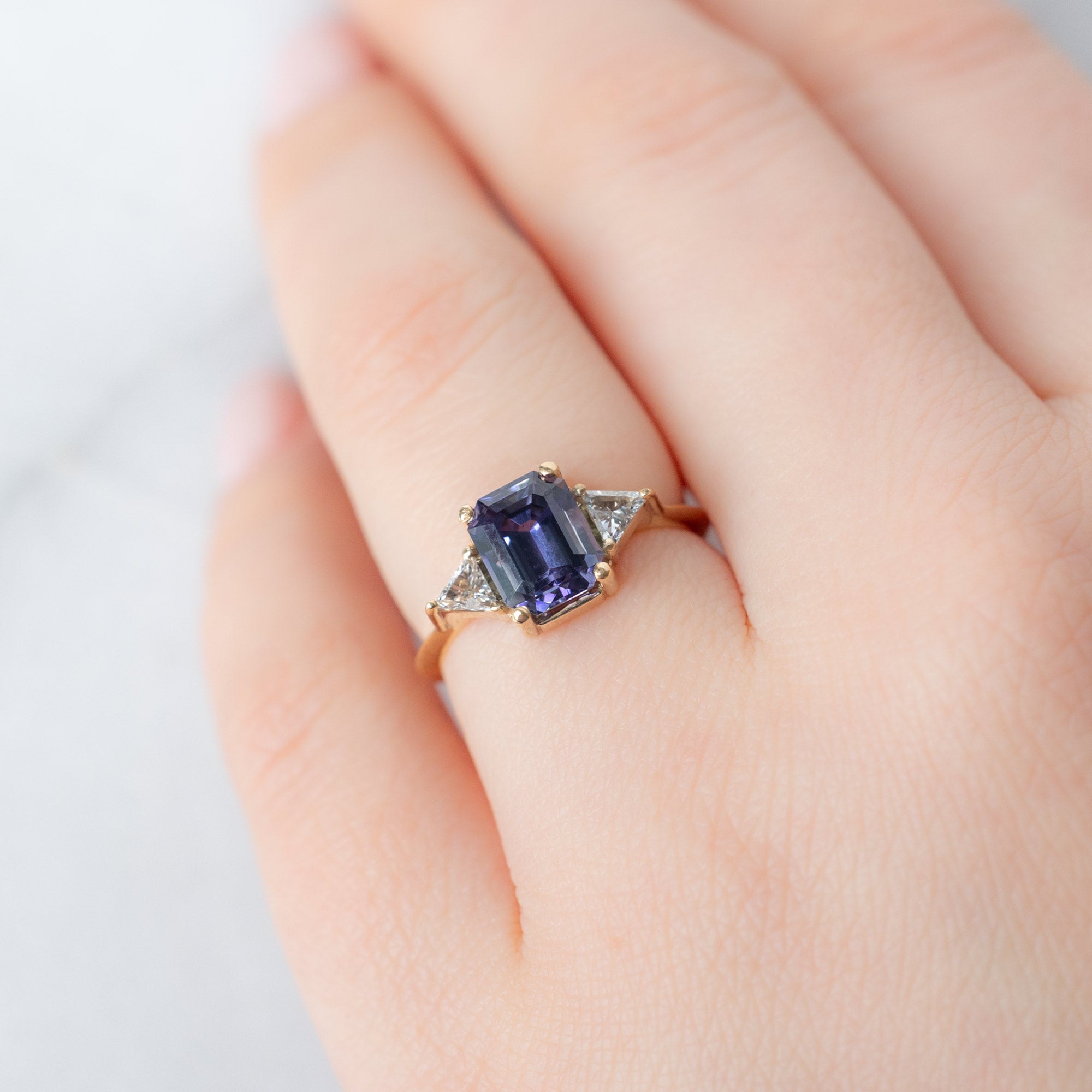 The Jade Ring with a 1.91ct Emerald Cut Purple Tanzanite in 14K Yellow Gold on Model