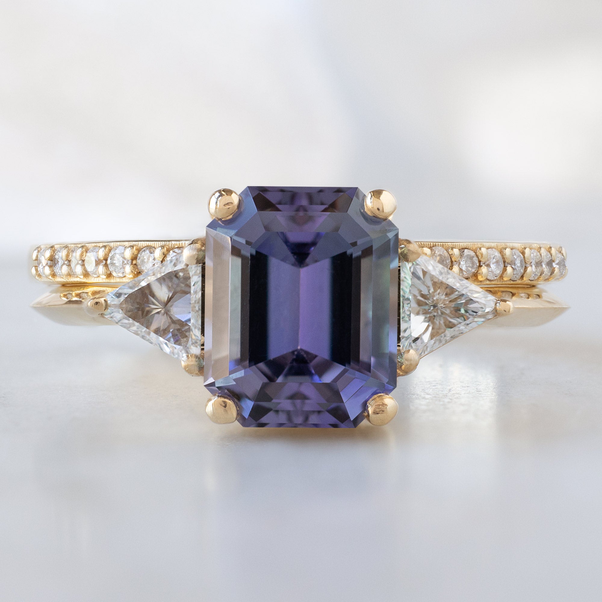 The Jade Ring with a 1.91ct Emerald Cut Purple Tanzanite in 14K Yellow Gold Stacked with the Open Cuff White Pavé Diamond Stacking Band