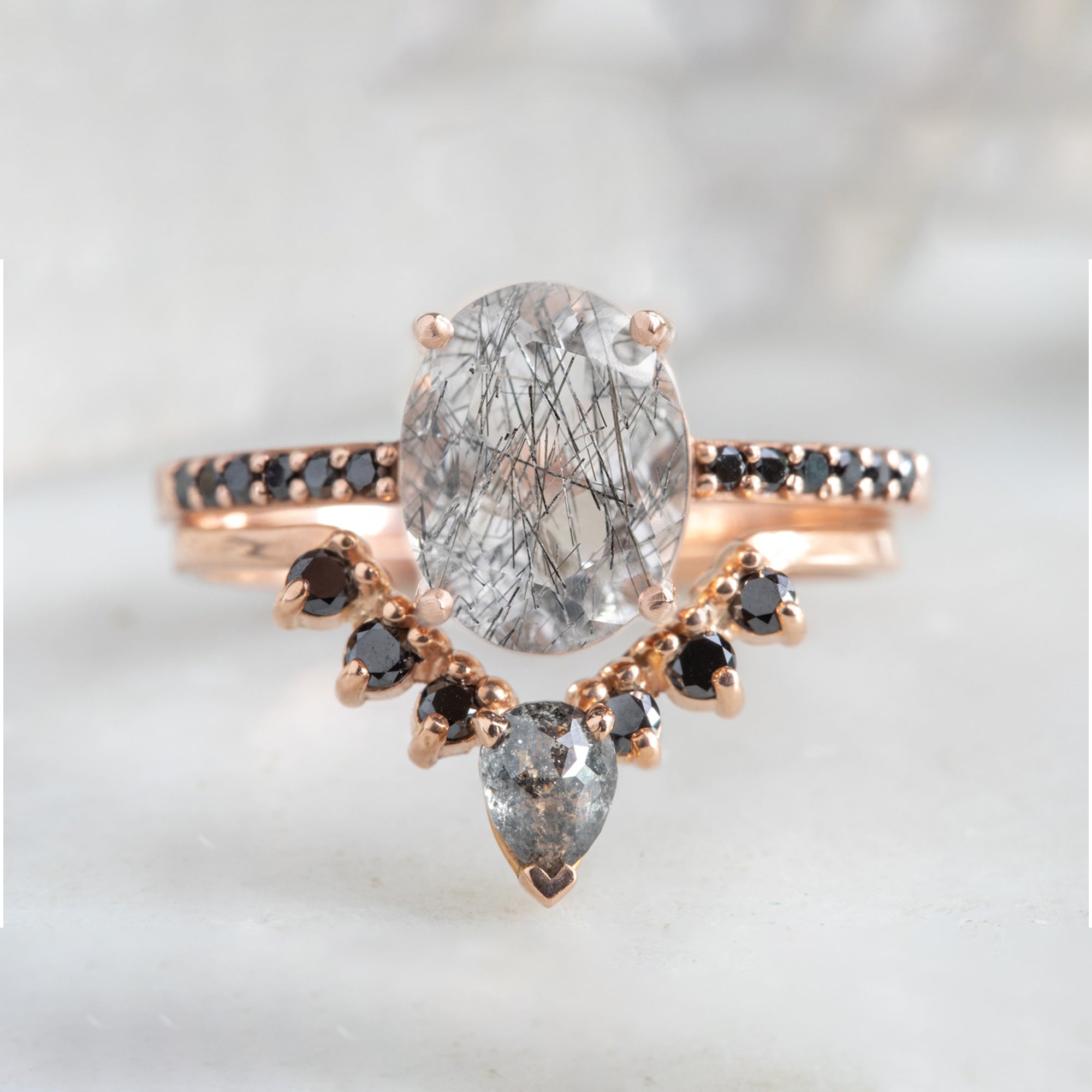 buy:the-willow-ring-2-08ct-oval-tourmaline-in-quartz-in-14k-rose-gold,one-of-a-kind-pear-black-diamond-sunburst-stacking-band-14k-gold