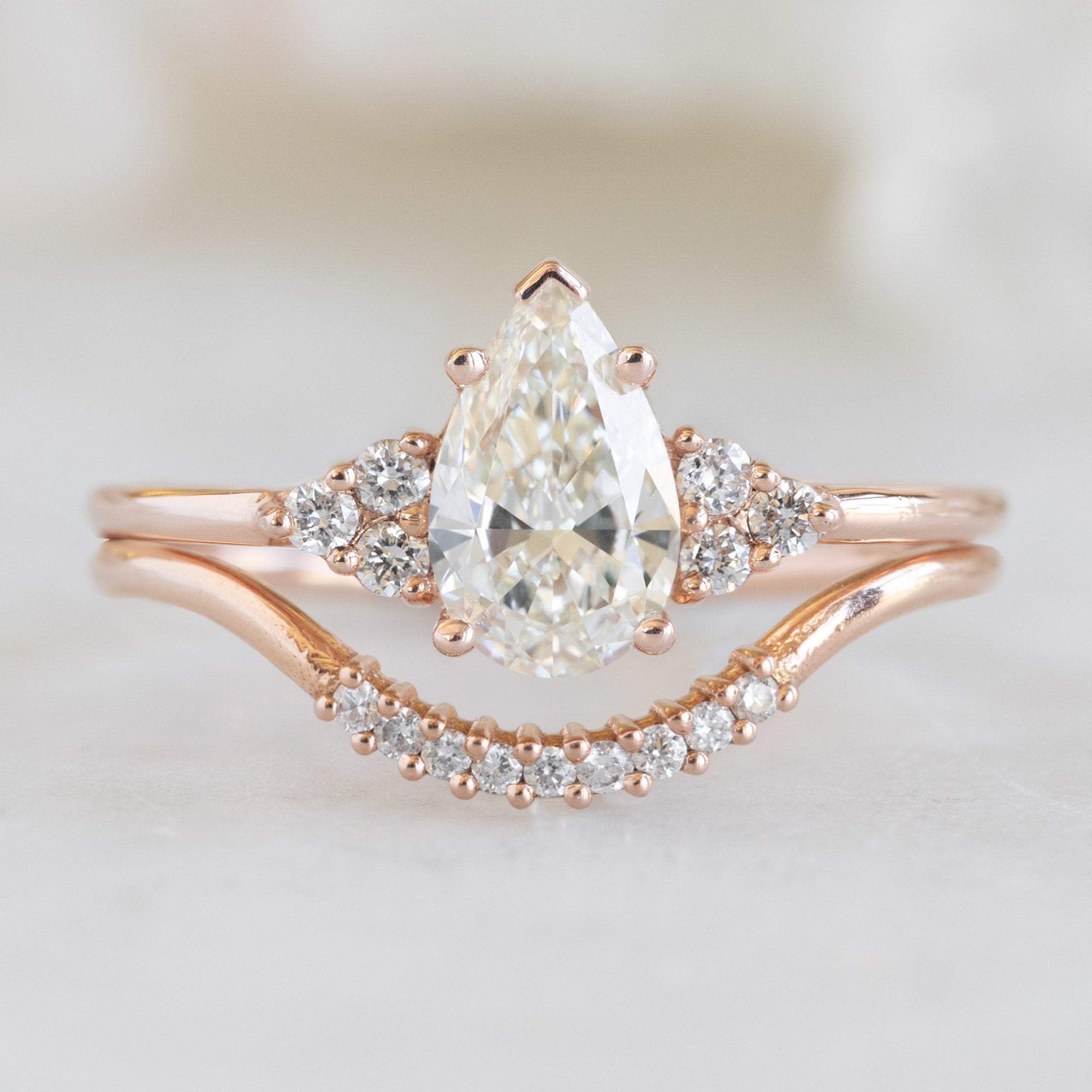 The Ivy Ring with a 0.70ct Pear White Diamond in 14k Rose Gold with White Diamond Pavé Stacking Band