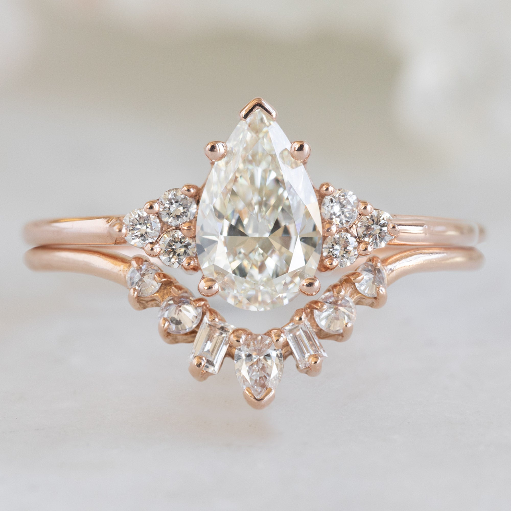 The Ivy Ring with a 0.70ct Pear White Diamond in 14k Rose Gold with GEometric White Diamond Sunburst Stacking Band