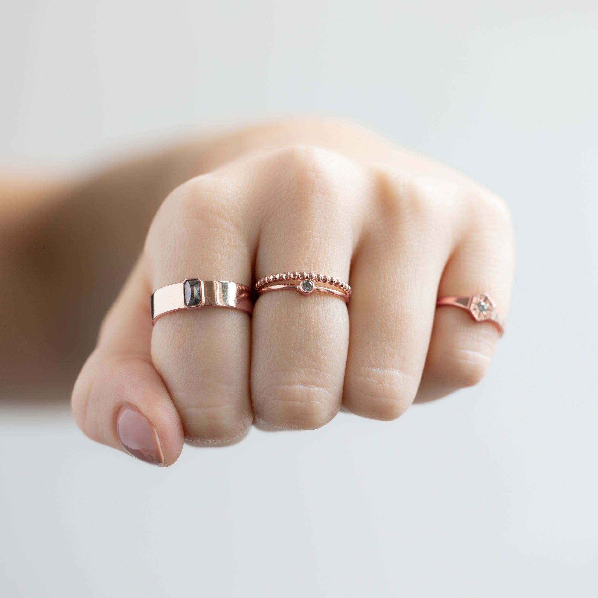 buy:the-cigar-band-0-38ct-emerald-salt-and-pepper-diamond-in-14k-rose-gold,the-gold-beaded-stacking-ring-14k-rose-gold,the-teensy-custom-salt-and-pepper-diamond-stacking-ring-14k-rose-gold,custom-white-diamond-birthstone-signet-ring-10k-rose-gold