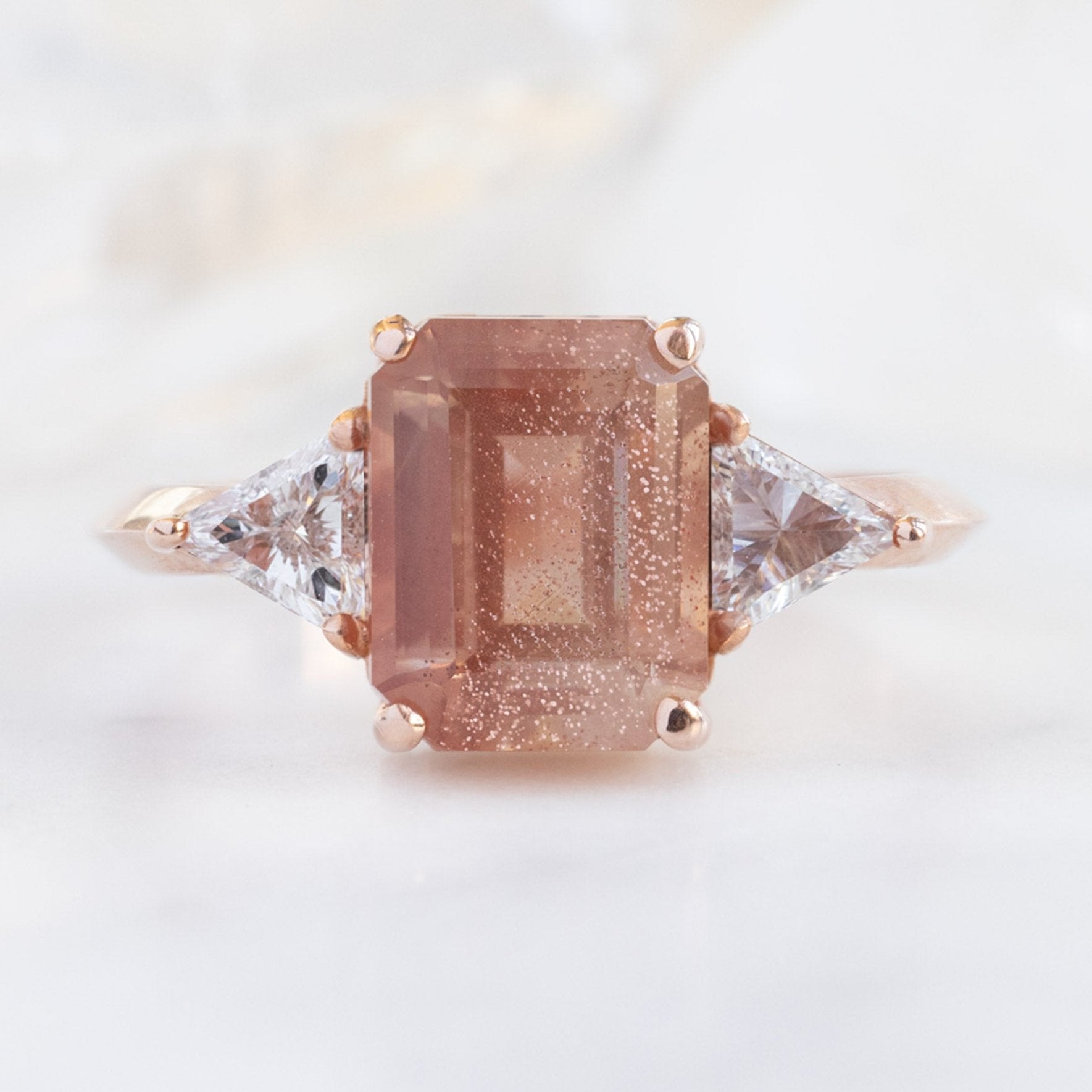 The Jade Ring with a 2.26ct Emerald Cut Sunstone in 14K Rose Gold on white background