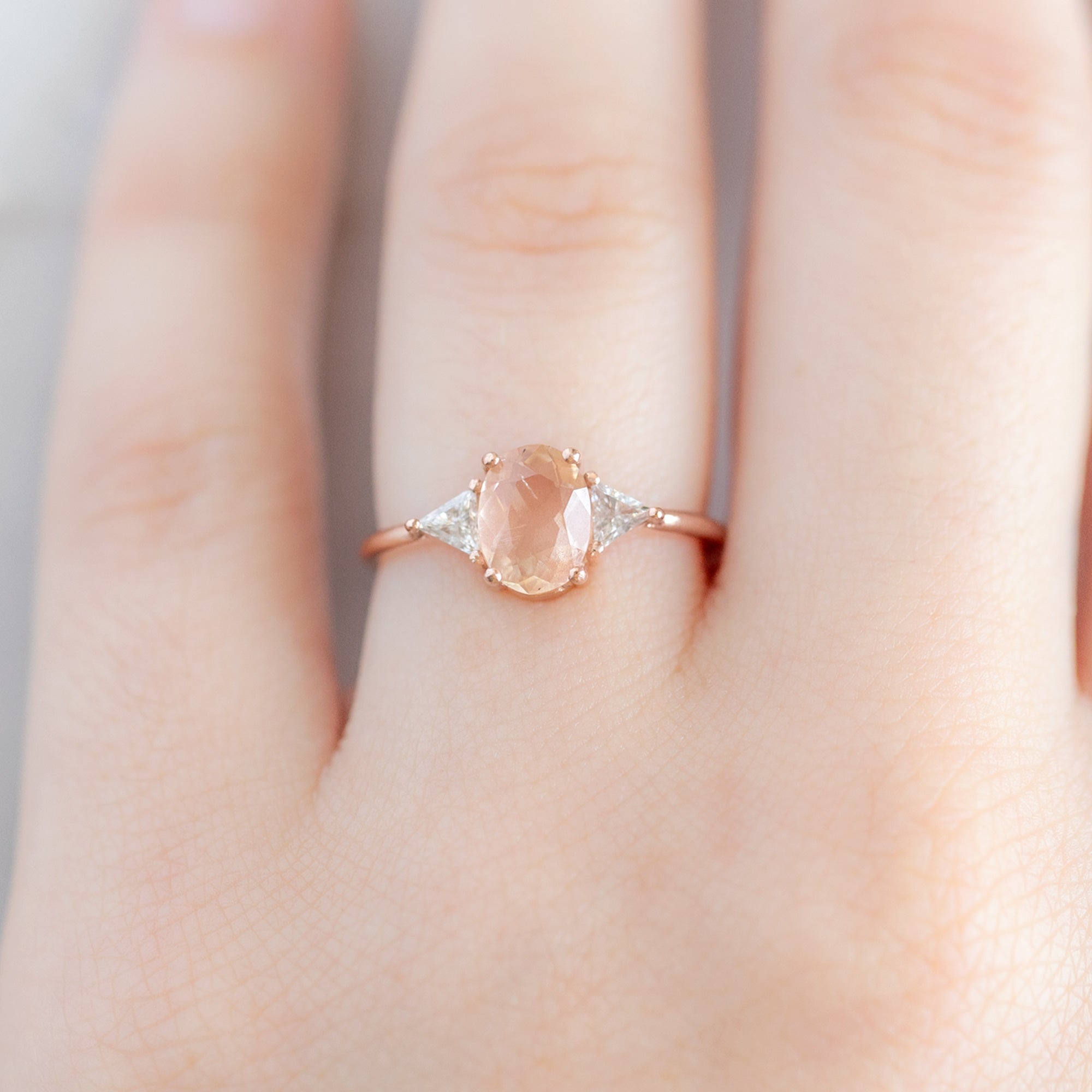 The Jade Ring with a 0.95ct Oval Sunstone in 14K Rose Gold on Model