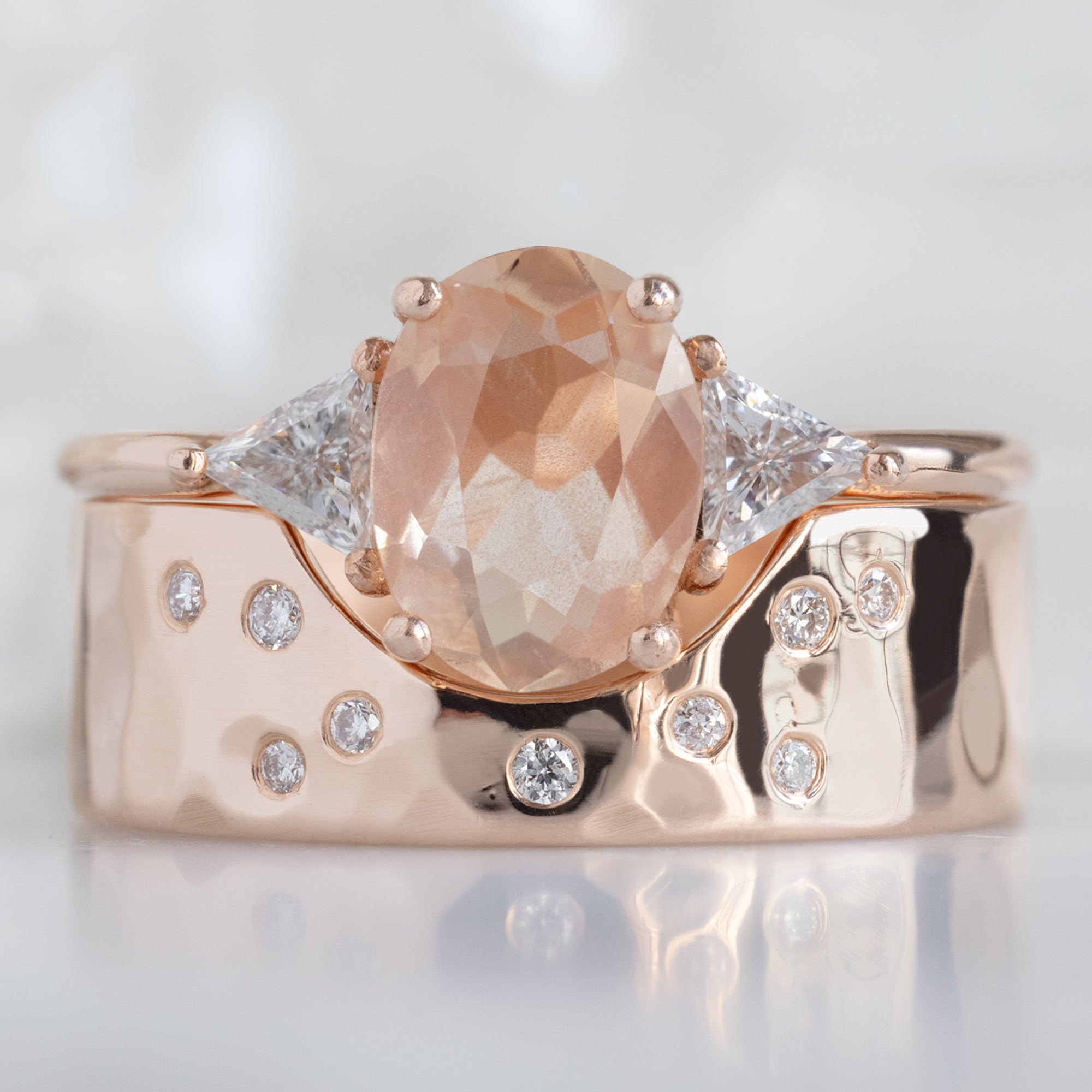 The Jade Ring with a 0.95ct Oval Sunstone in 14K Rose Gold Stacked with the Constellation Arc Cut-Out Stacking Band