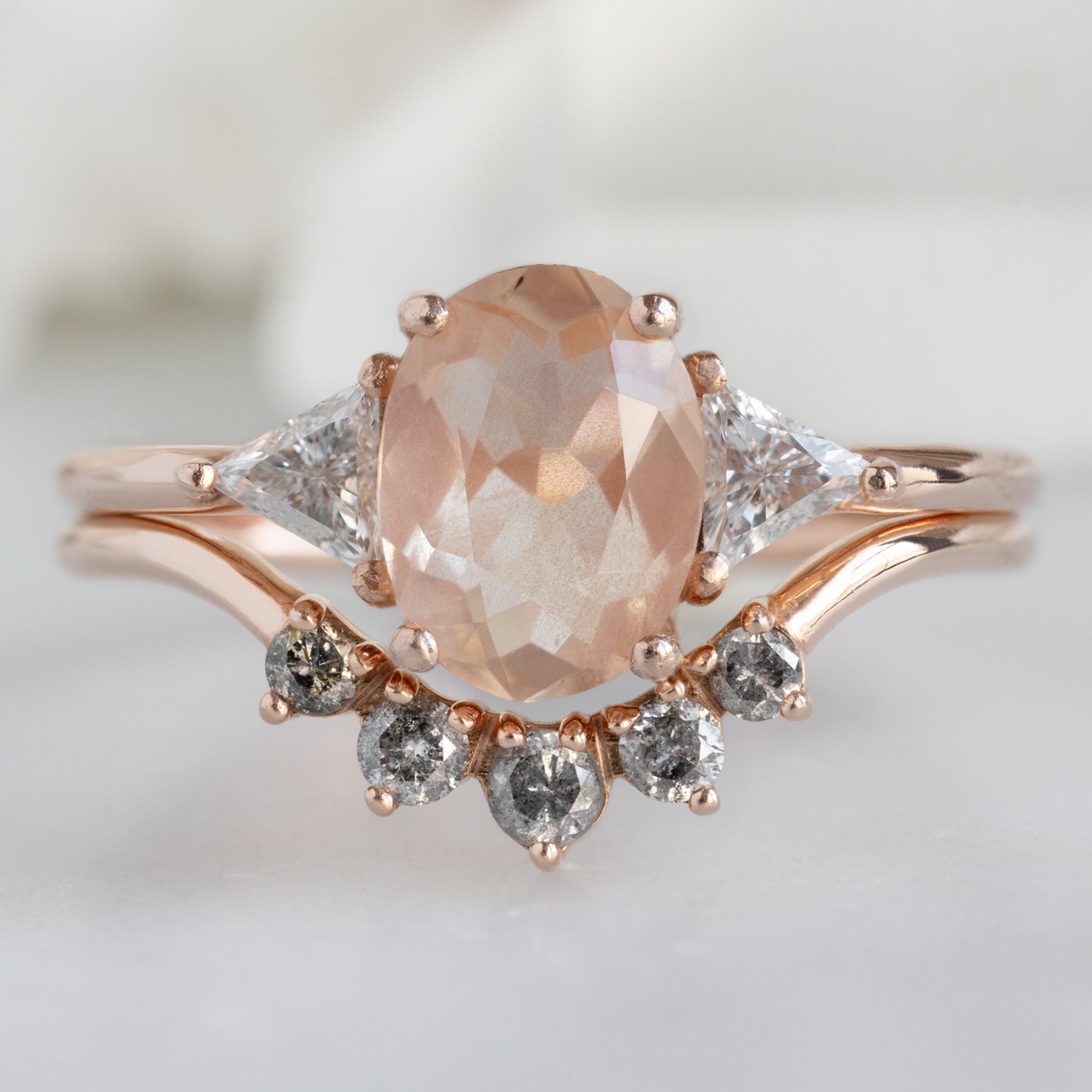 The Jade Ring with a 0.95ct Oval Sunstone in 14K Rose Gold Stacked with the Round Diamond Sunburst Stacking Band