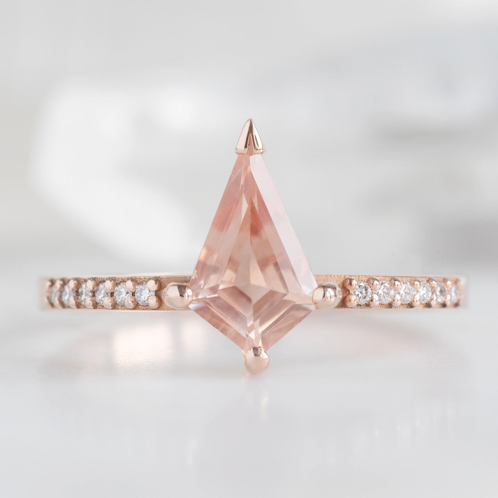 The Willow Ring with a 0.79ct Kite Sunstone in 14K Rose Gold on White Marble