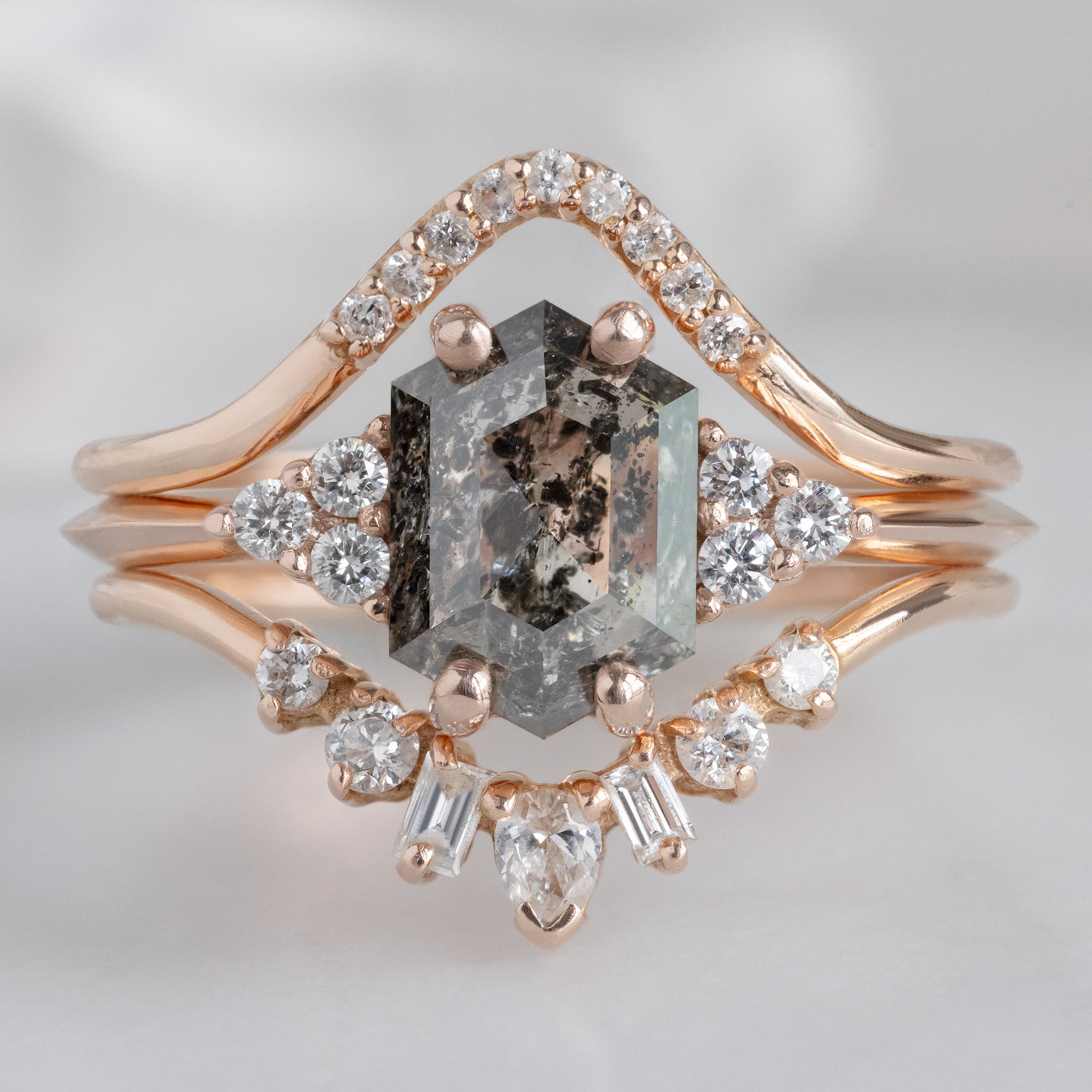 The Ivy Ring with a 1.49ct Hexagon Salt and Pepper Diamond in 14K Rose Gold Stacked with Diamond Wedding Bands