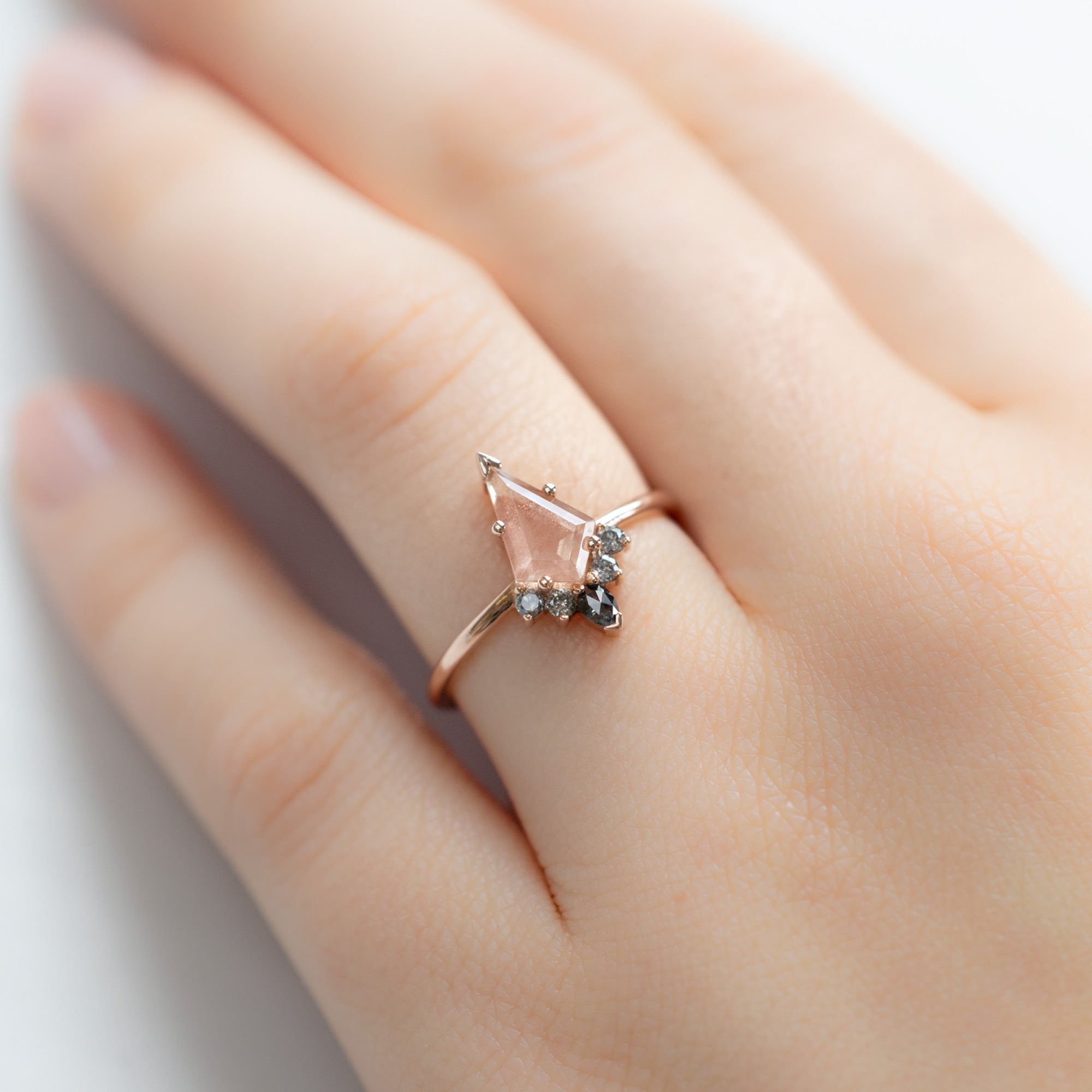 The Aster Ring | 0.79 carat Kite Sunstone in 14K Rose Gold displayed on model's left hand ring finger. 