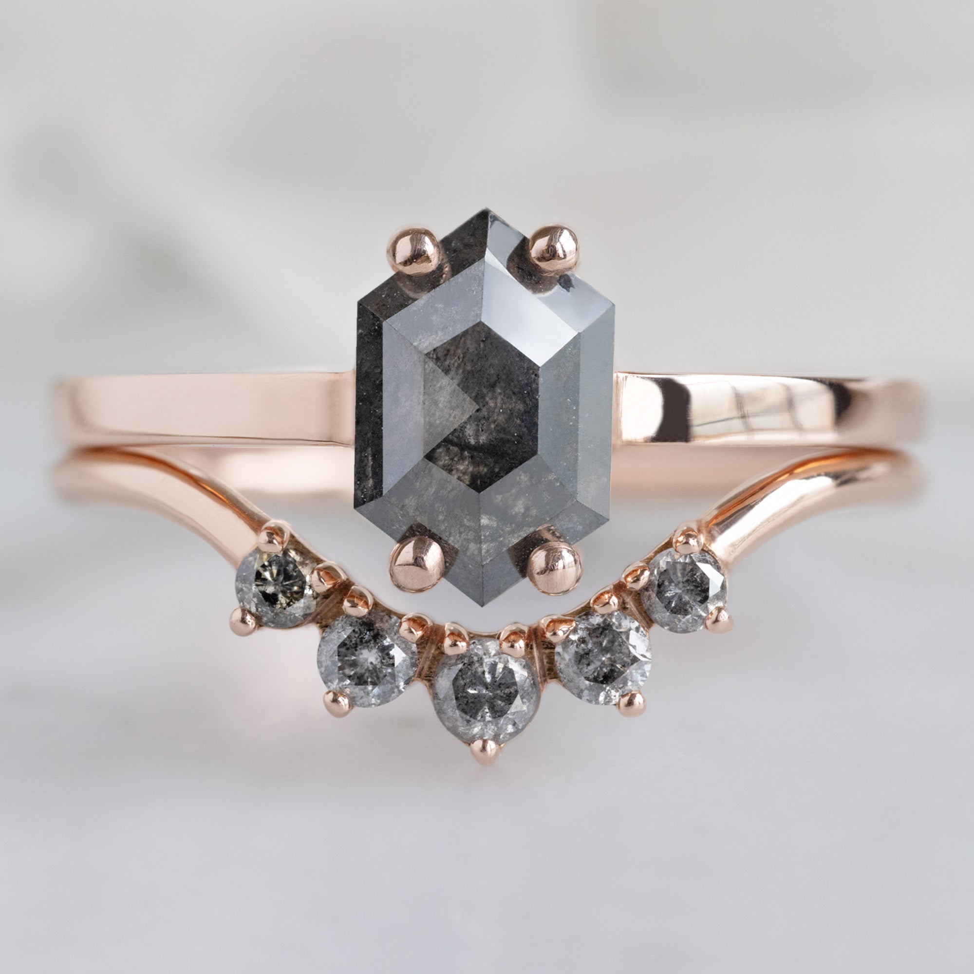 The Bryn Ring with a 0.88 carat Black Hexagon Diamond in 14K Rose Gold Stacked with Round Salt and Pepper Diamond Sunburst Stacking Band