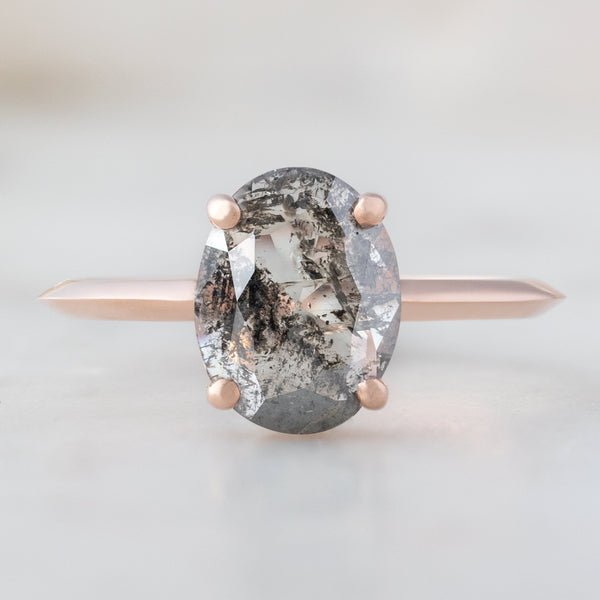 The Bryn Ring with a 0.89ct Oval Cut Salt and Pepper Diamond in 14K Rose Gold on white background